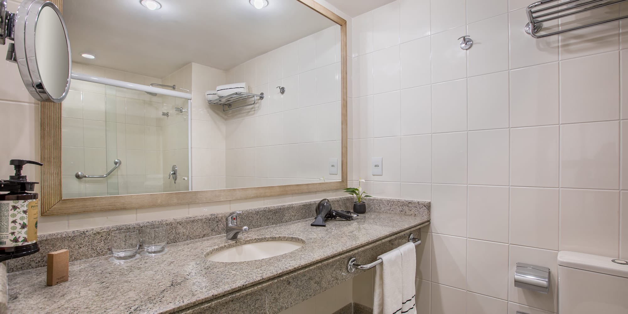 a bathroom with a large mirror and sink