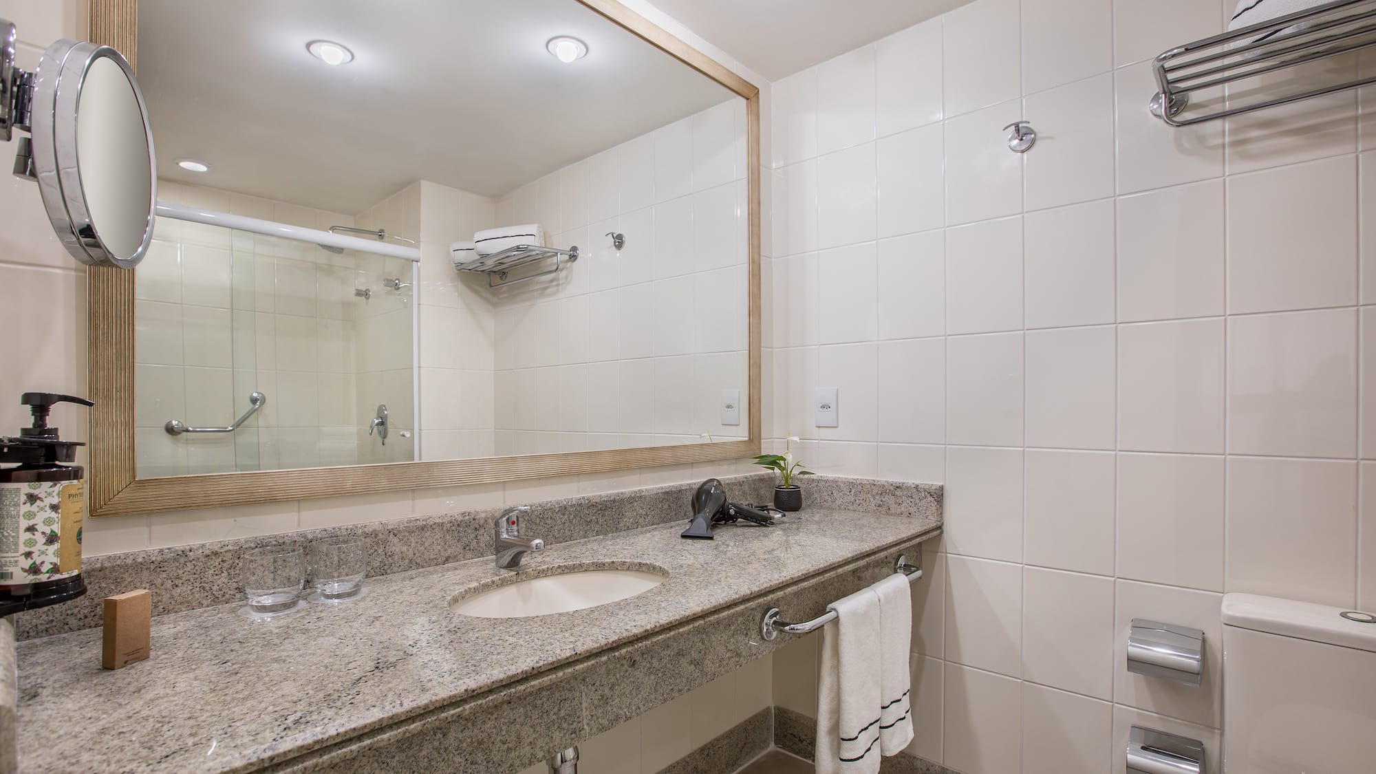 a bathroom with a large mirror and sink
