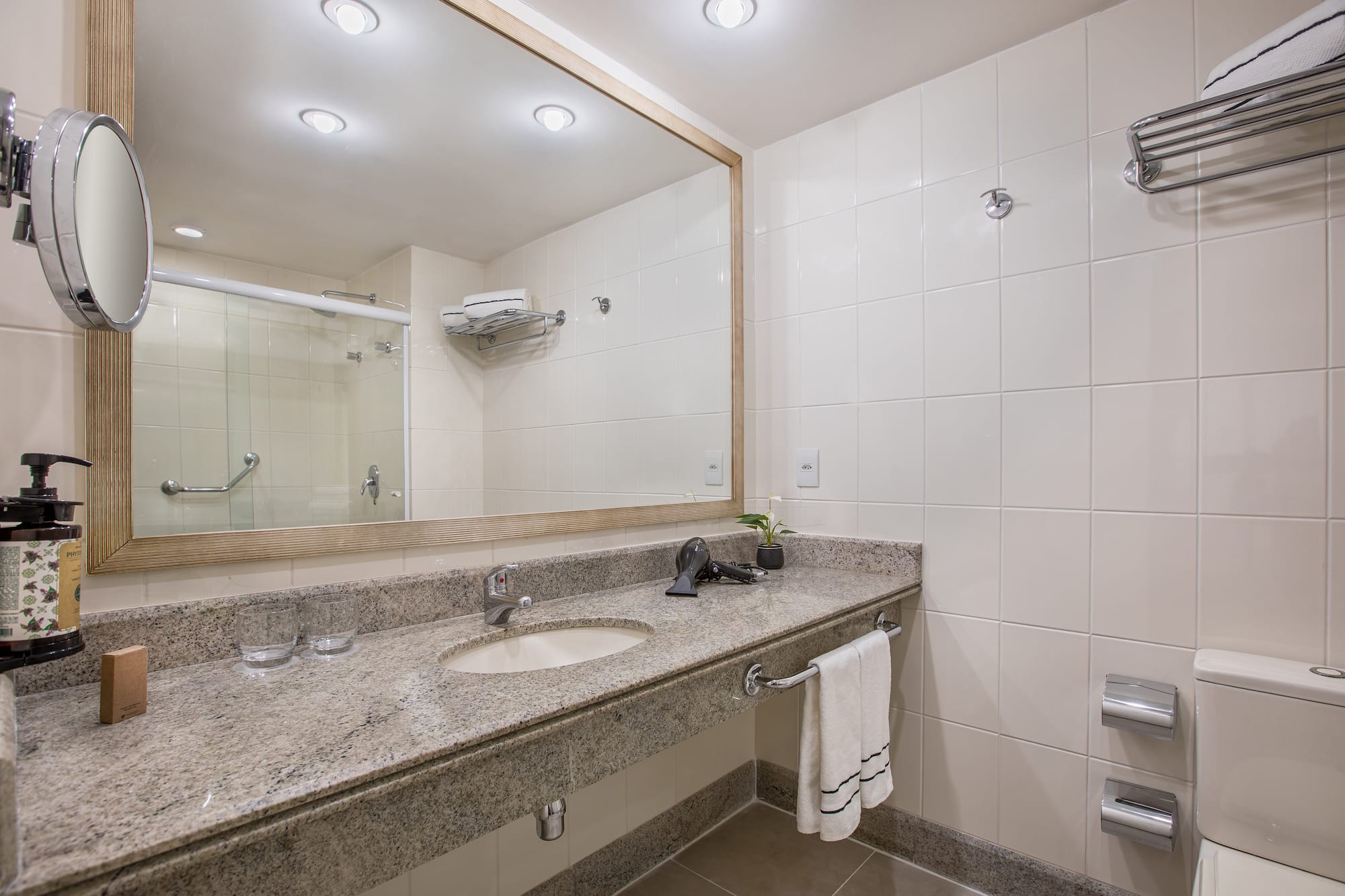 a bathroom with a large mirror and sink