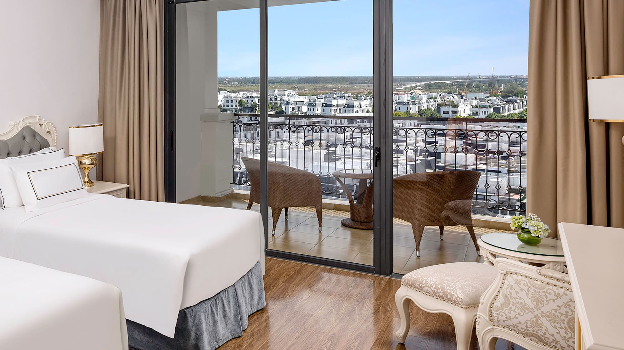 a room with two beds and a glass door