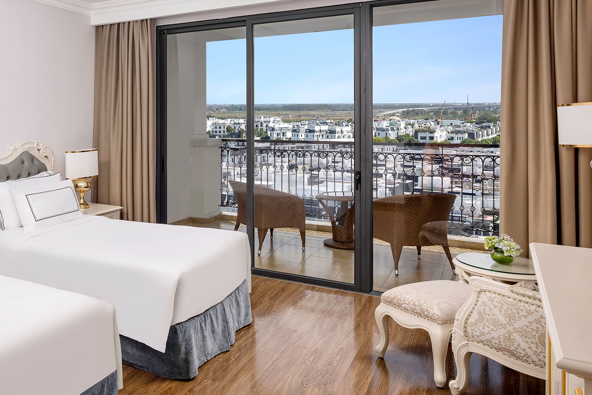 a room with two beds and a glass door