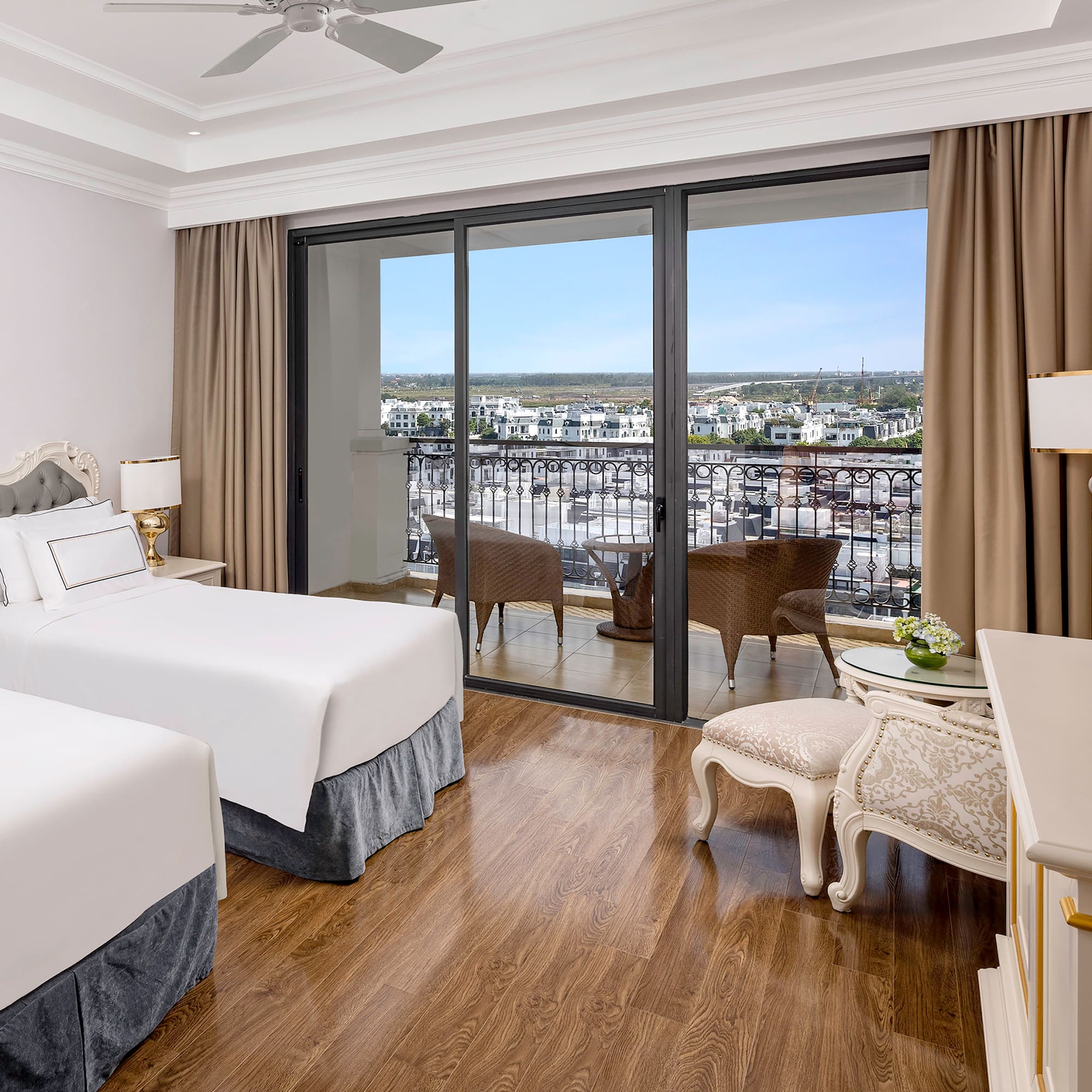 a room with two beds and a glass door