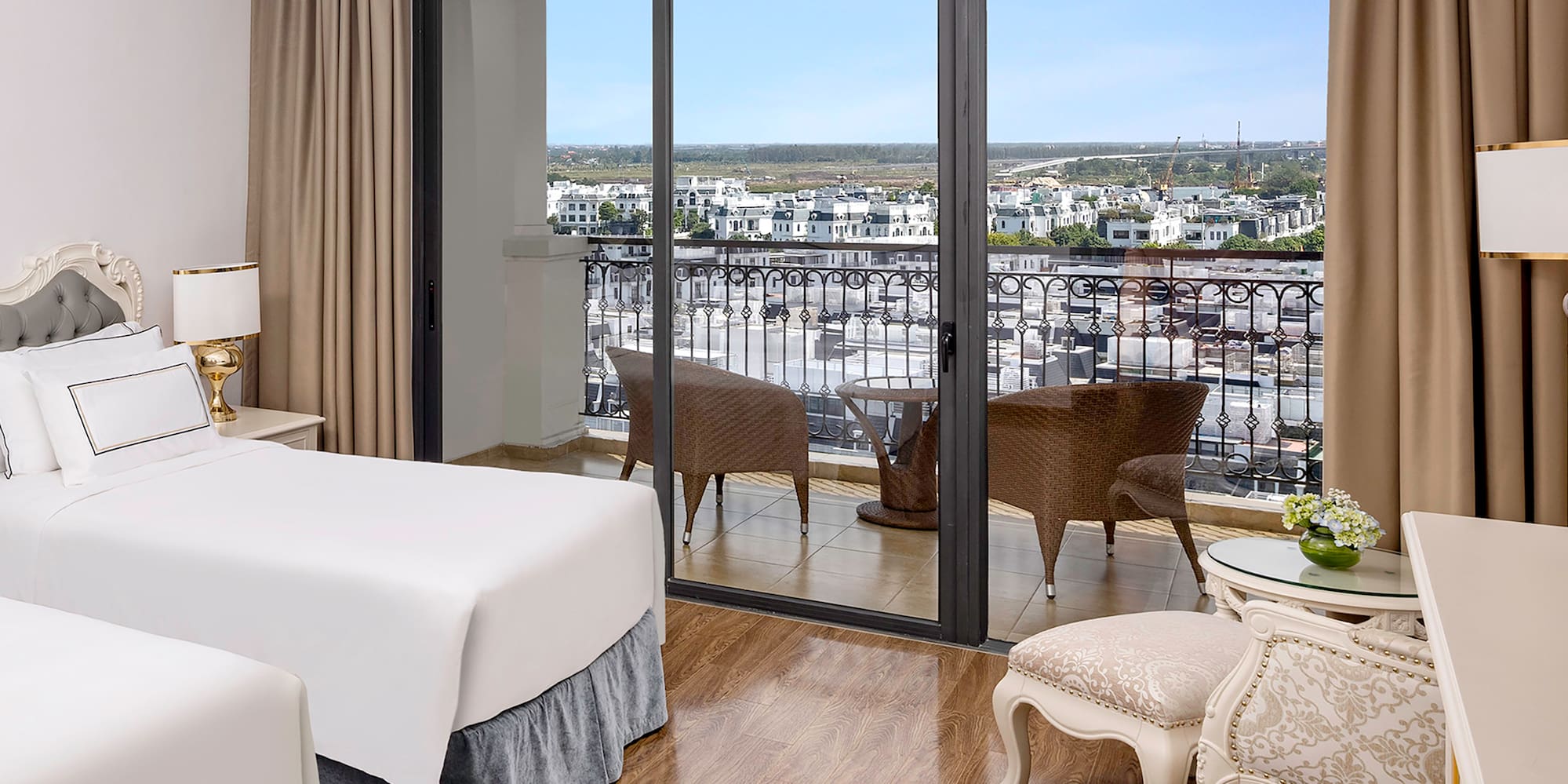 a room with two beds and a glass door