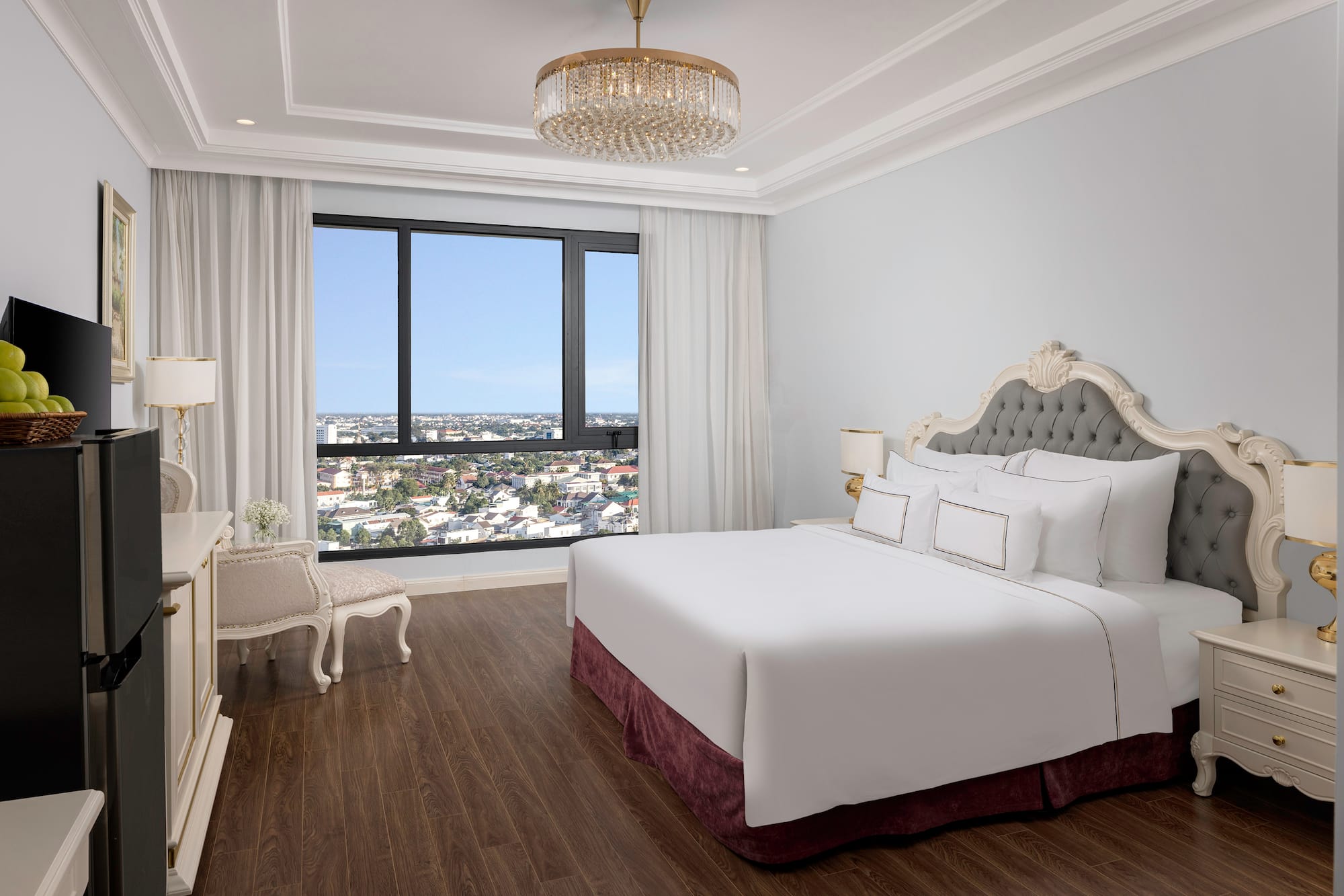 a bedroom with a large bed and a large window