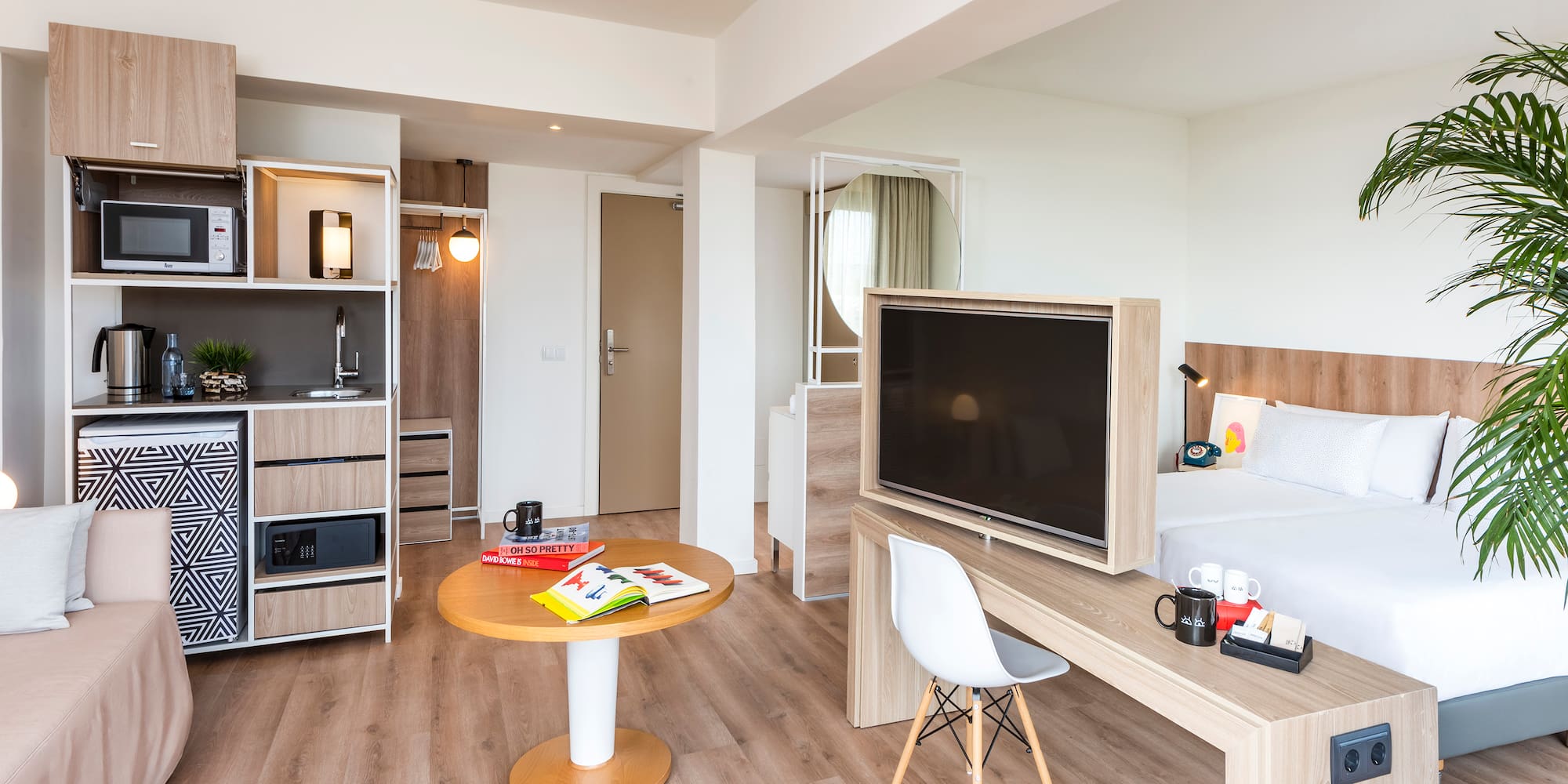 a room with a bed and a tv