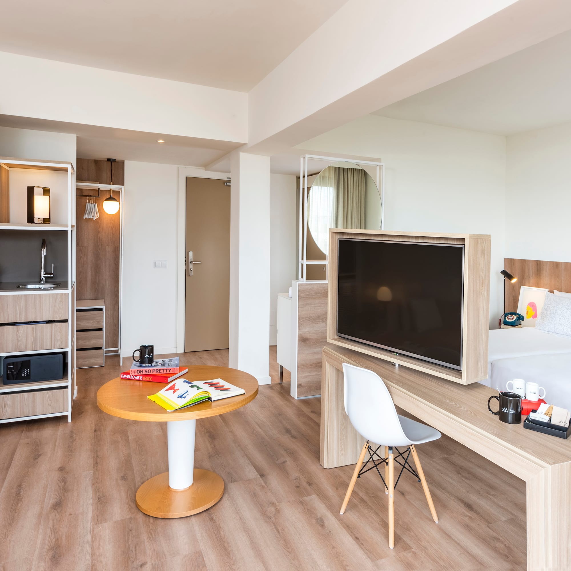 a room with a bed and a tv