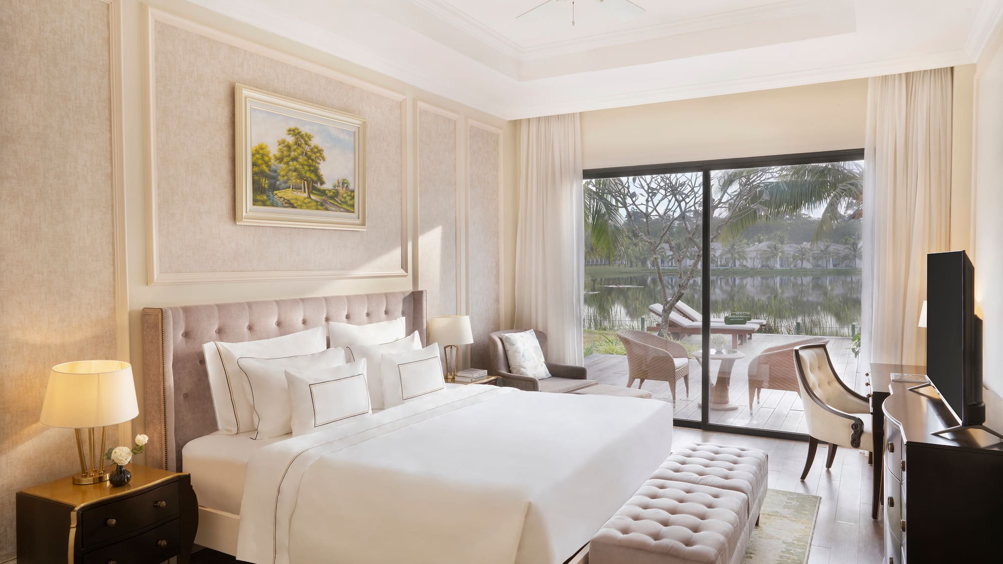 a bedroom with a large bed and a glass door.