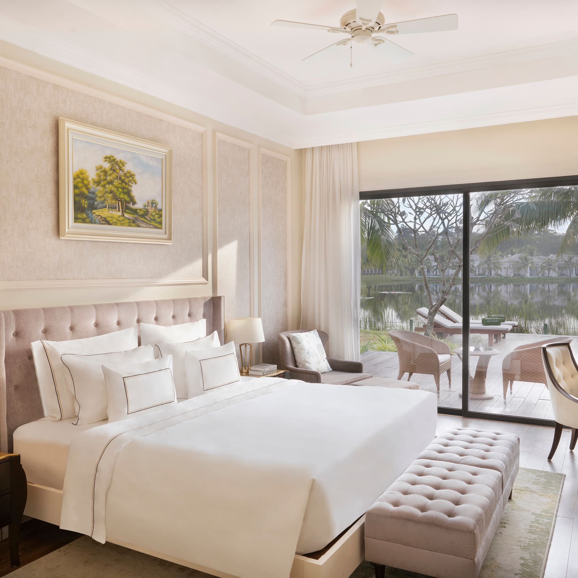 a bedroom with a large bed and a glass door.