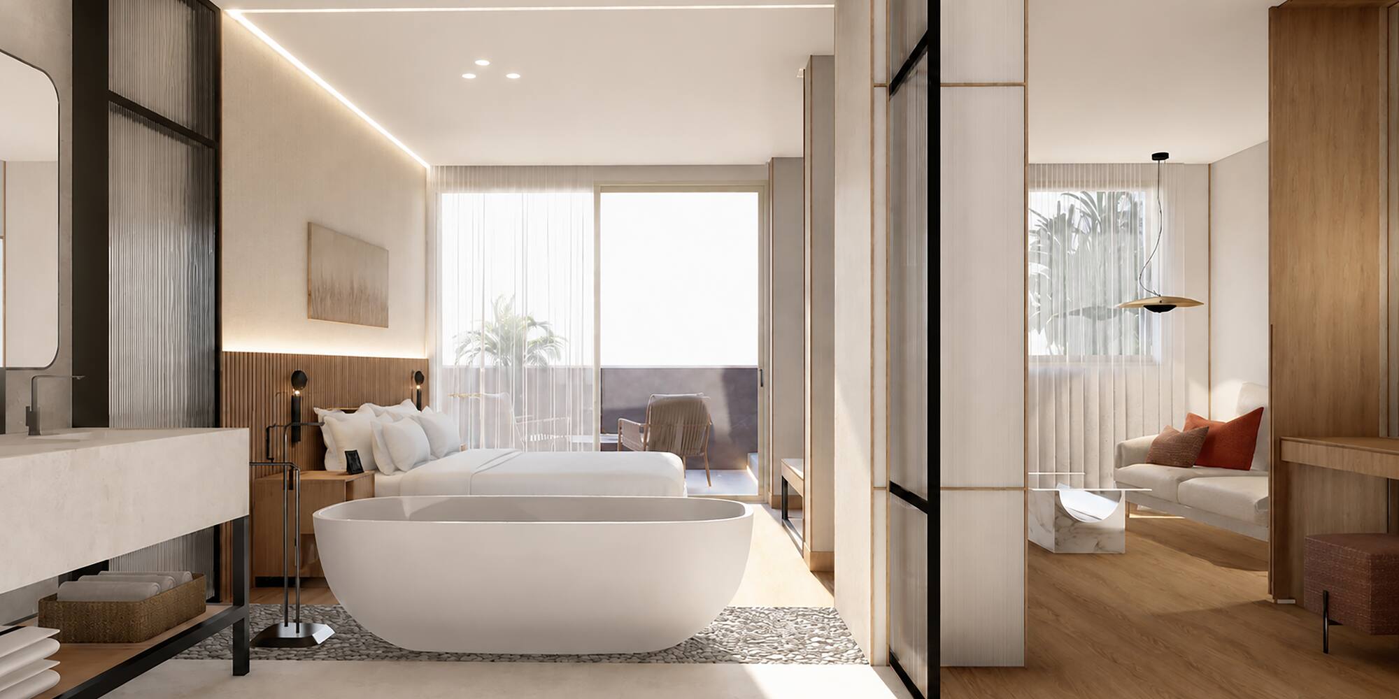 Modern luxury hotel suite with bedroom, freestanding tub, and balcony living area.
