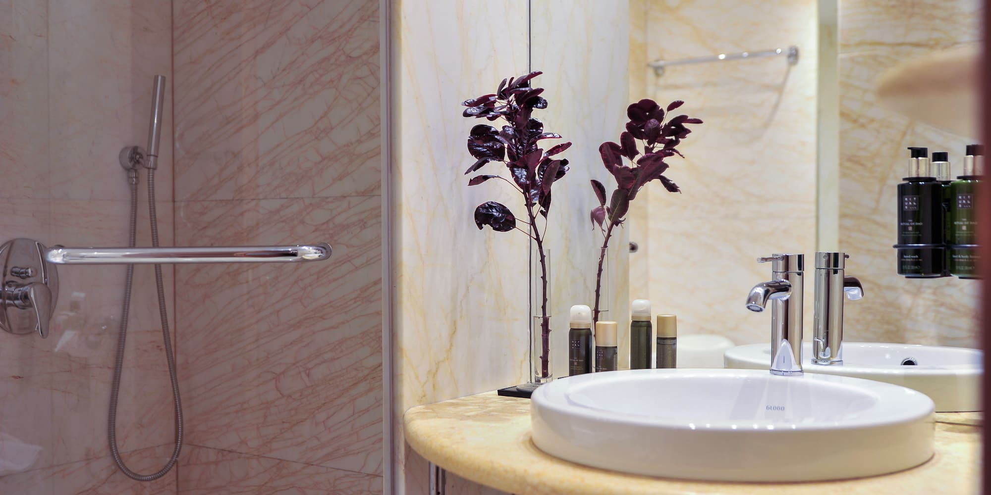 a bathroom with a sink and shower