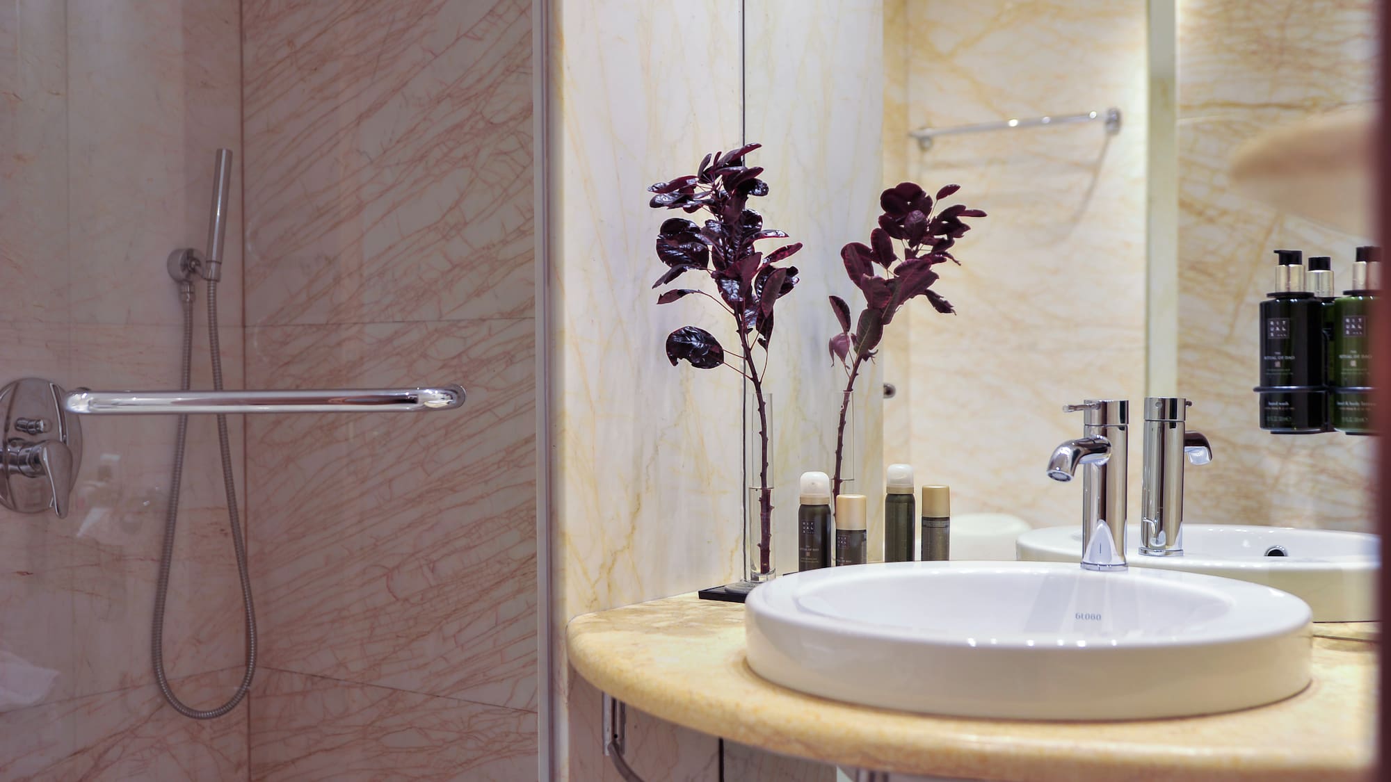 a bathroom with a sink and shower