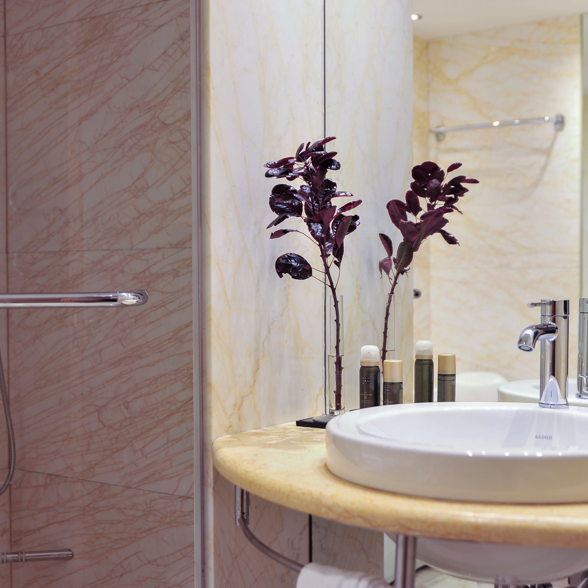 a bathroom with a sink and shower