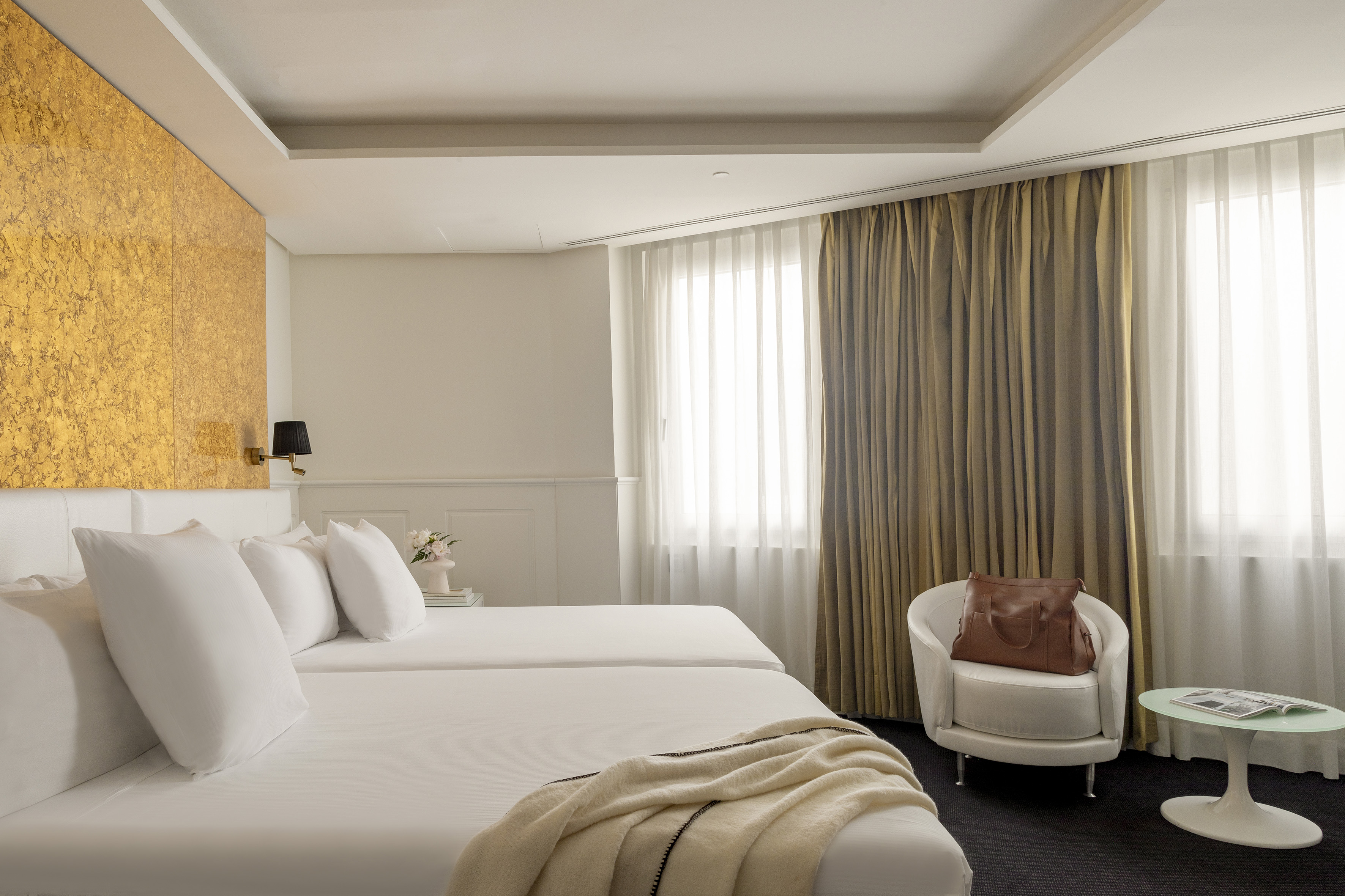 a room with a bed and a chair.