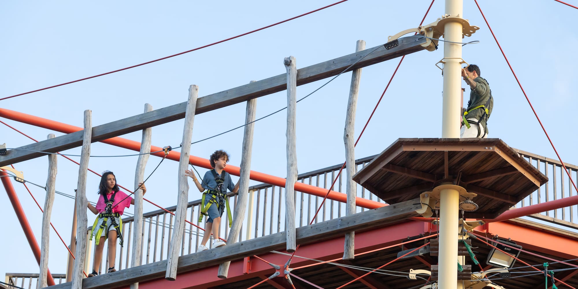 a group of kids on a bridge