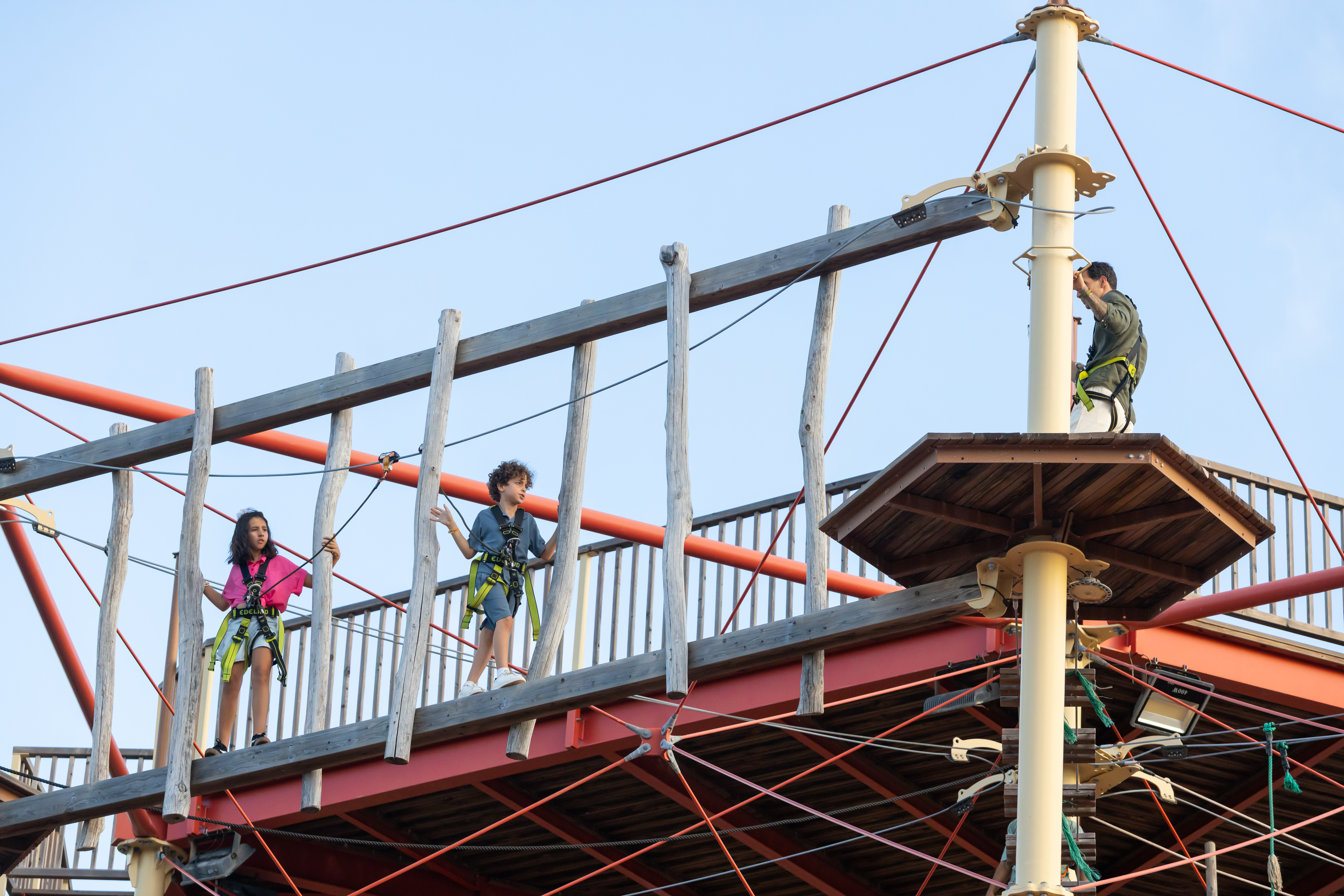 a group of kids on a bridge