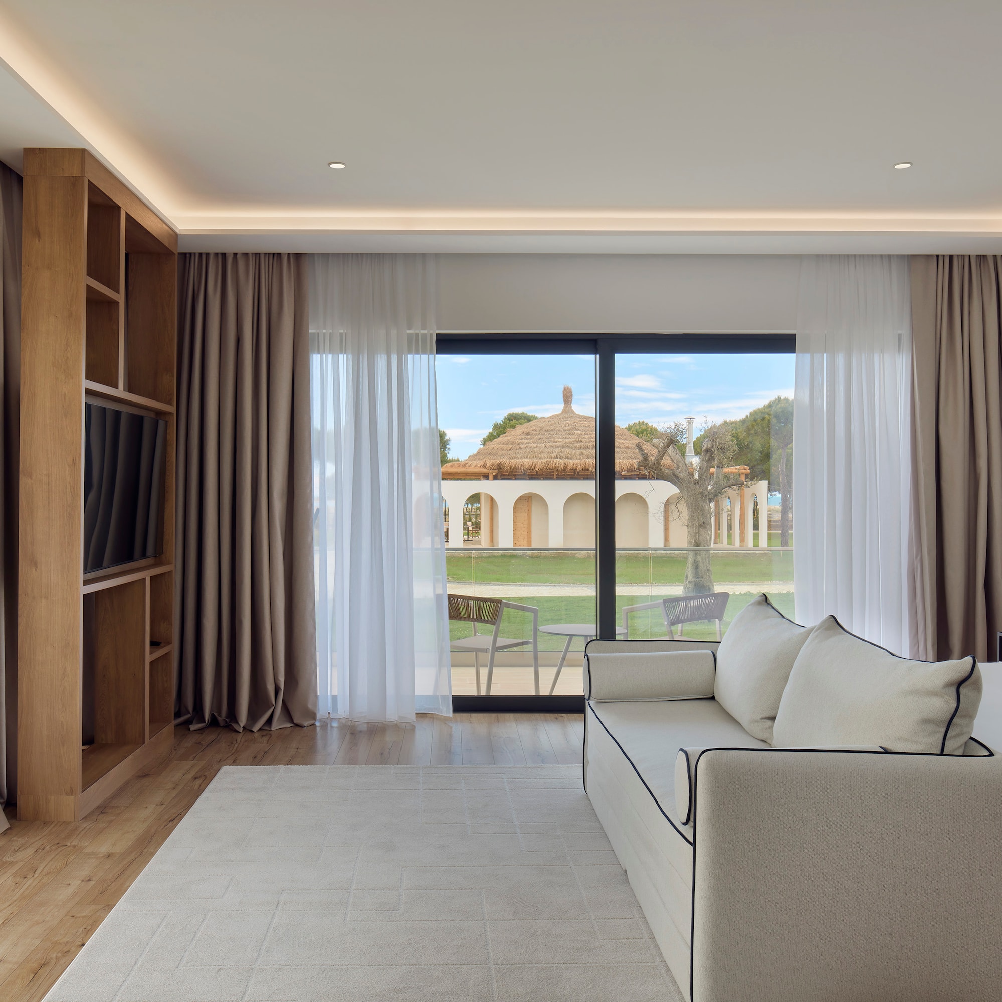 a living room with a couch and a bookcase