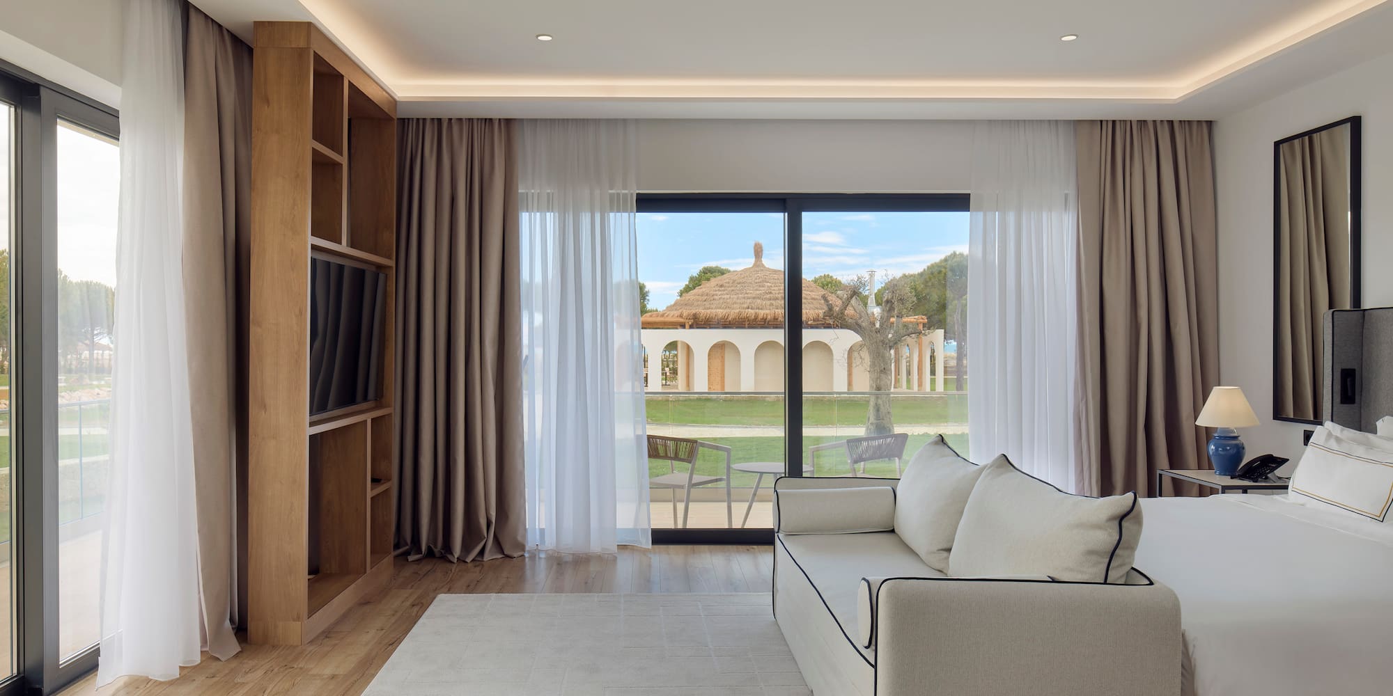 a living room with a couch and a bookcase