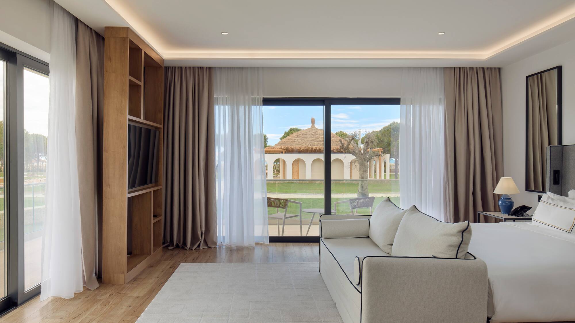 a living room with a couch and a bookcase
