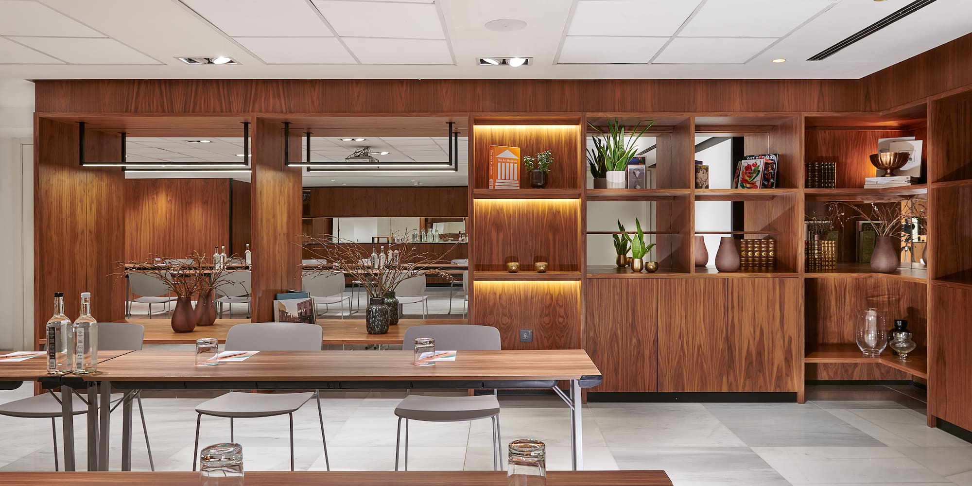 a room with wood shelves and tables