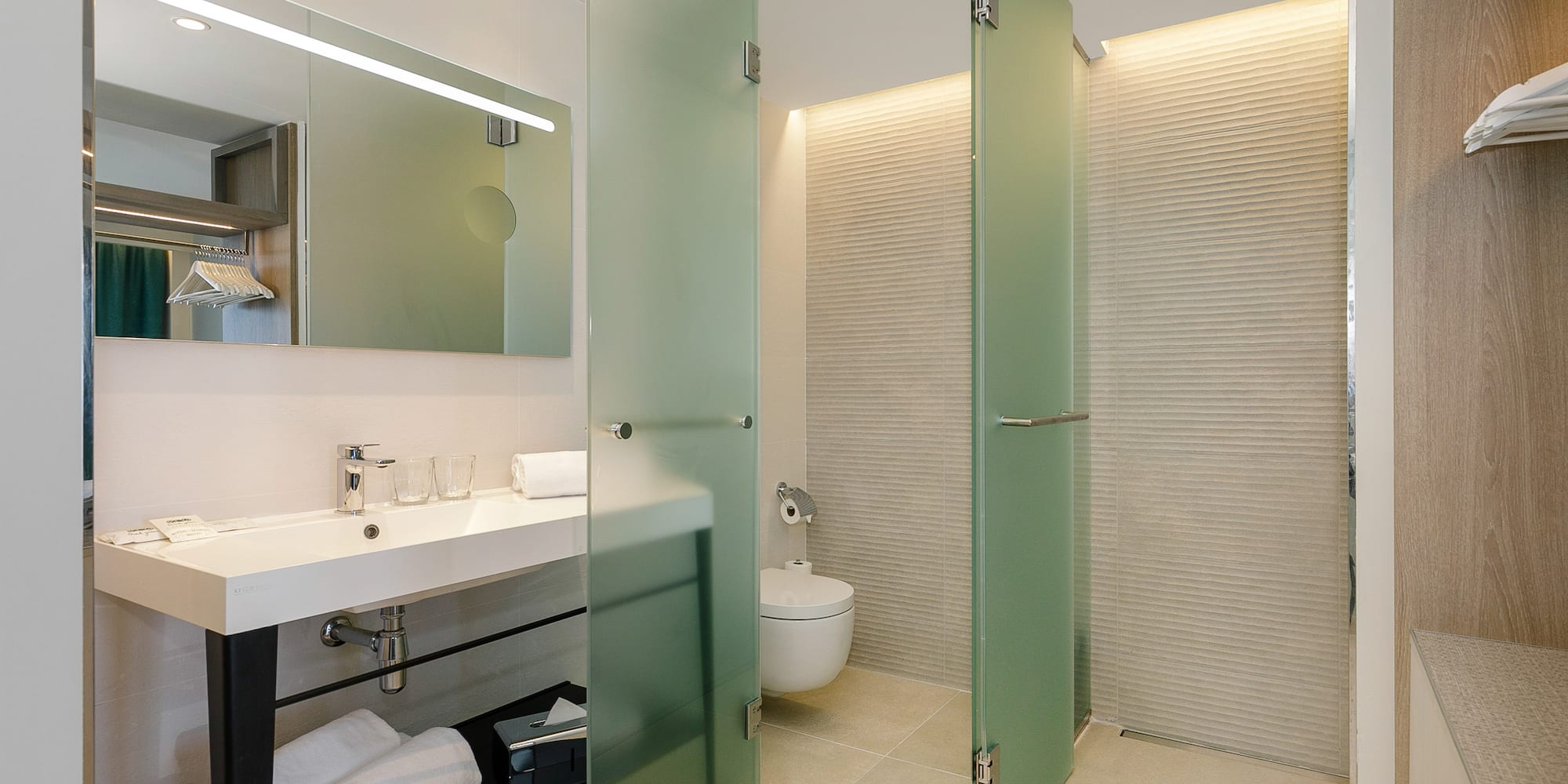 a bathroom with glass doors