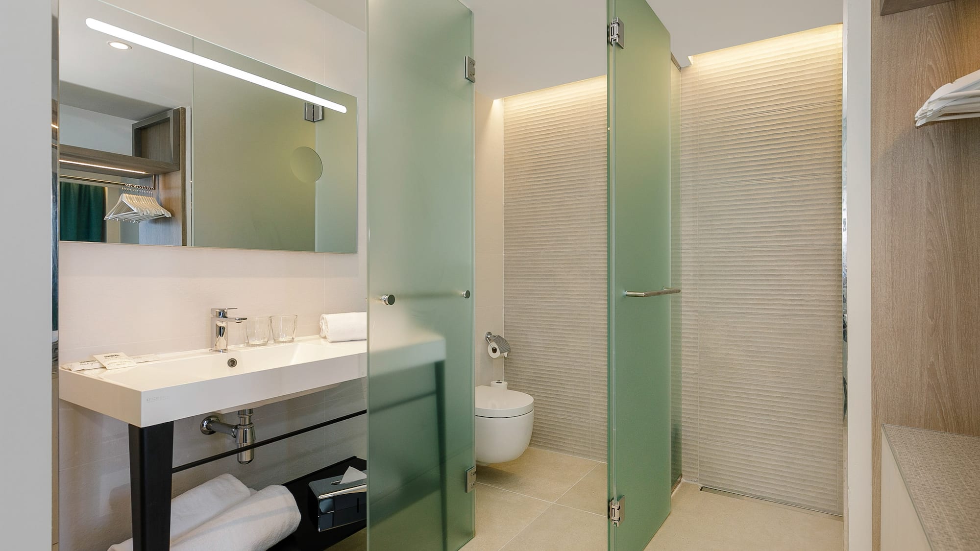 a bathroom with glass doors