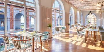 a room with tables and chairs