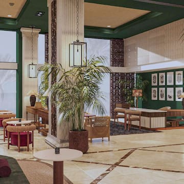 a lobby with chairs and tables