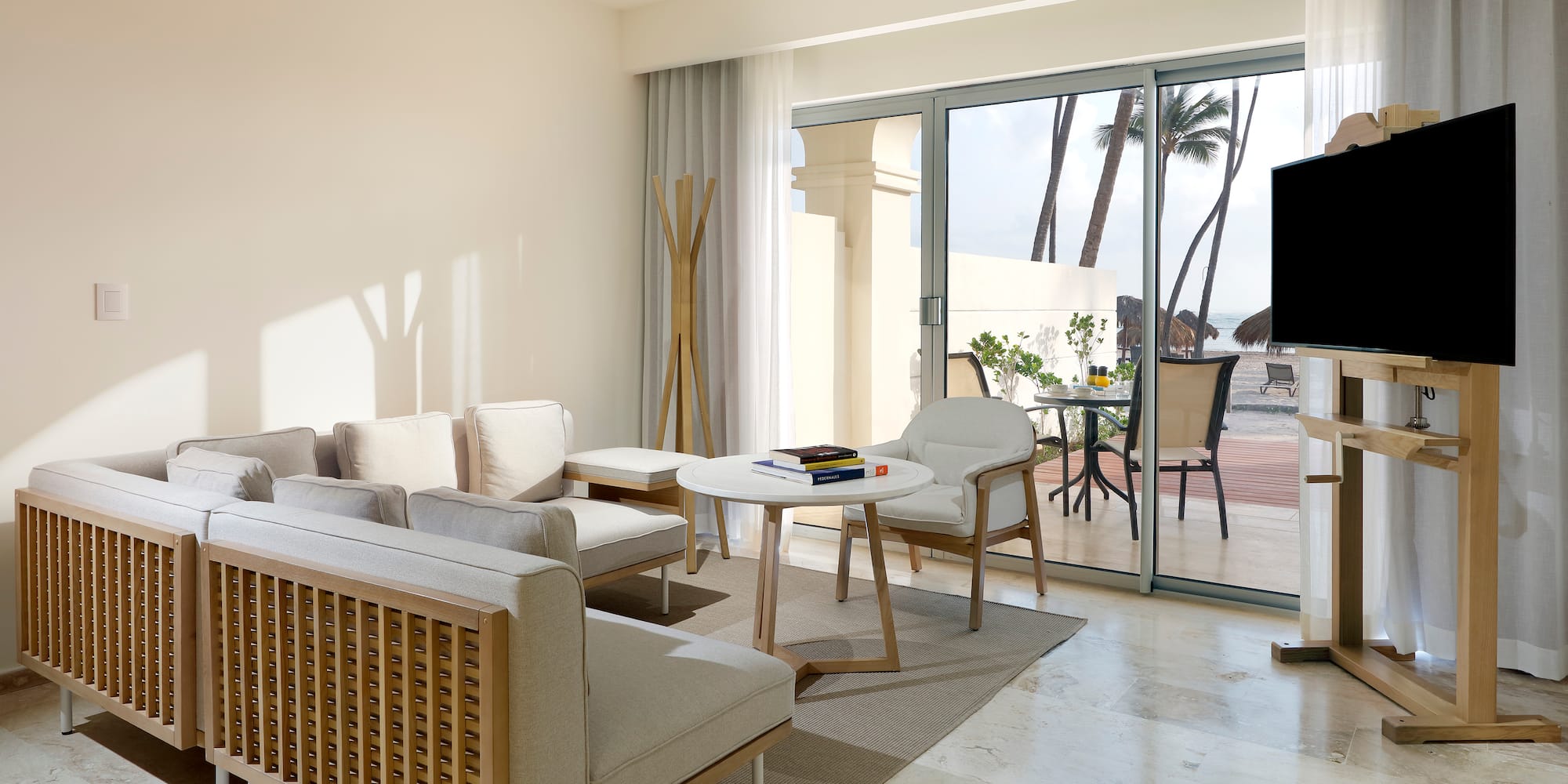 a living room with a television and a table