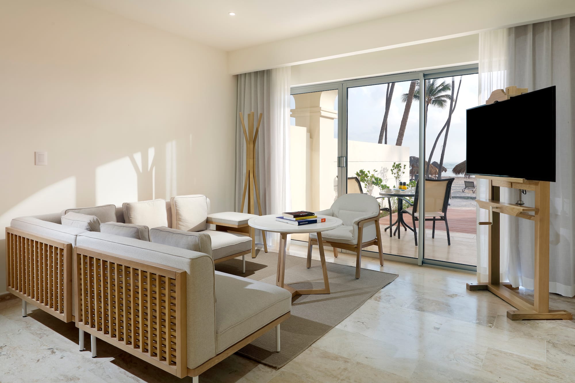 a living room with a television and a table