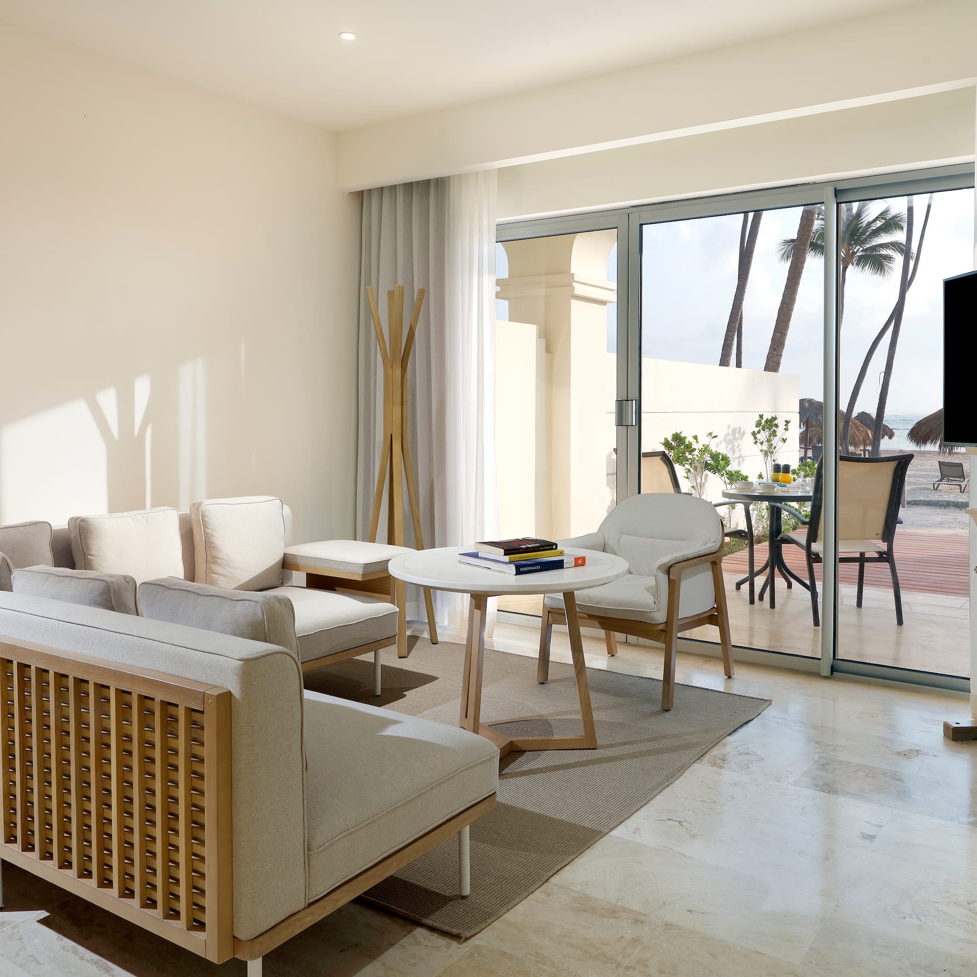 a living room with a television and a table