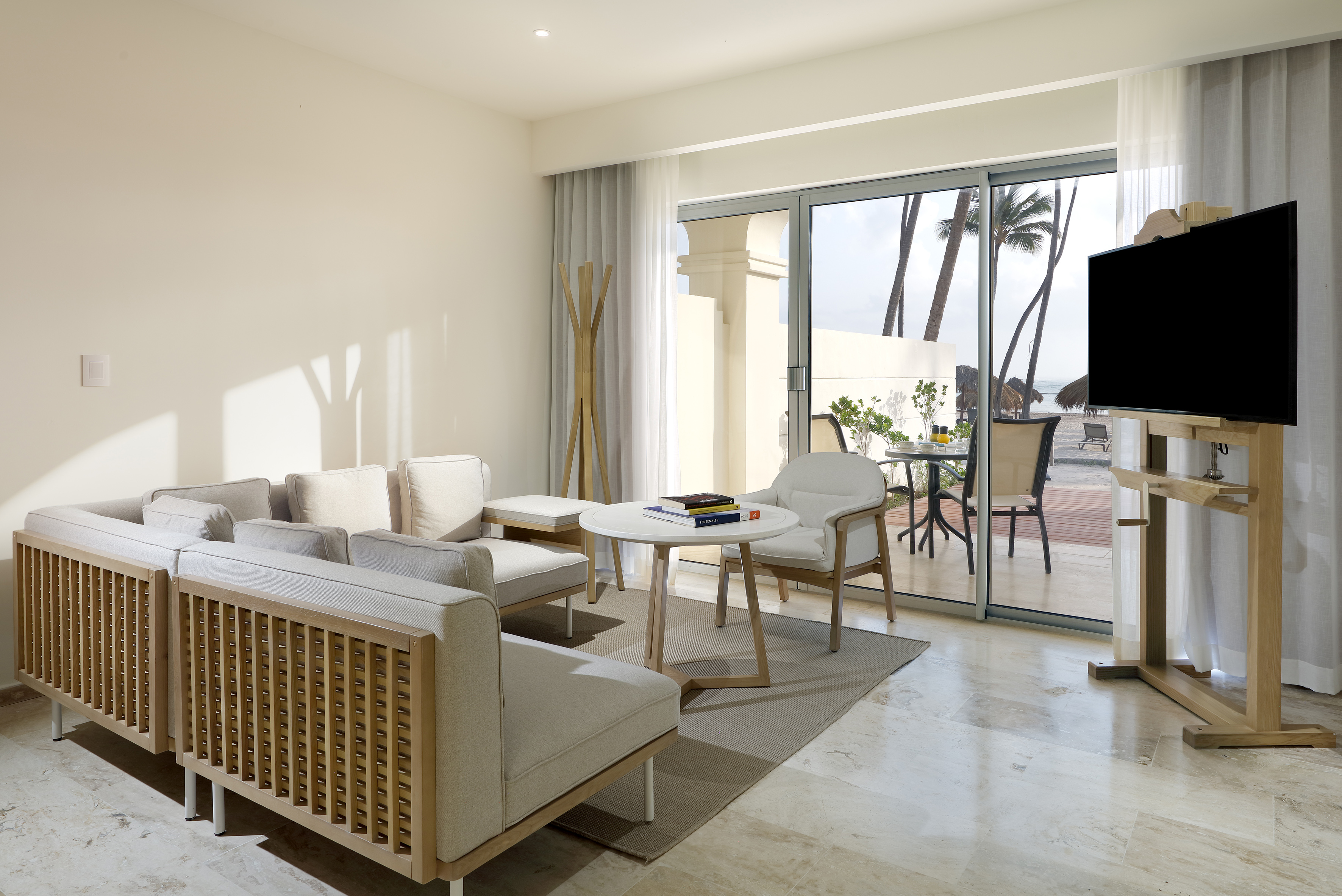 a living room with a television and a table