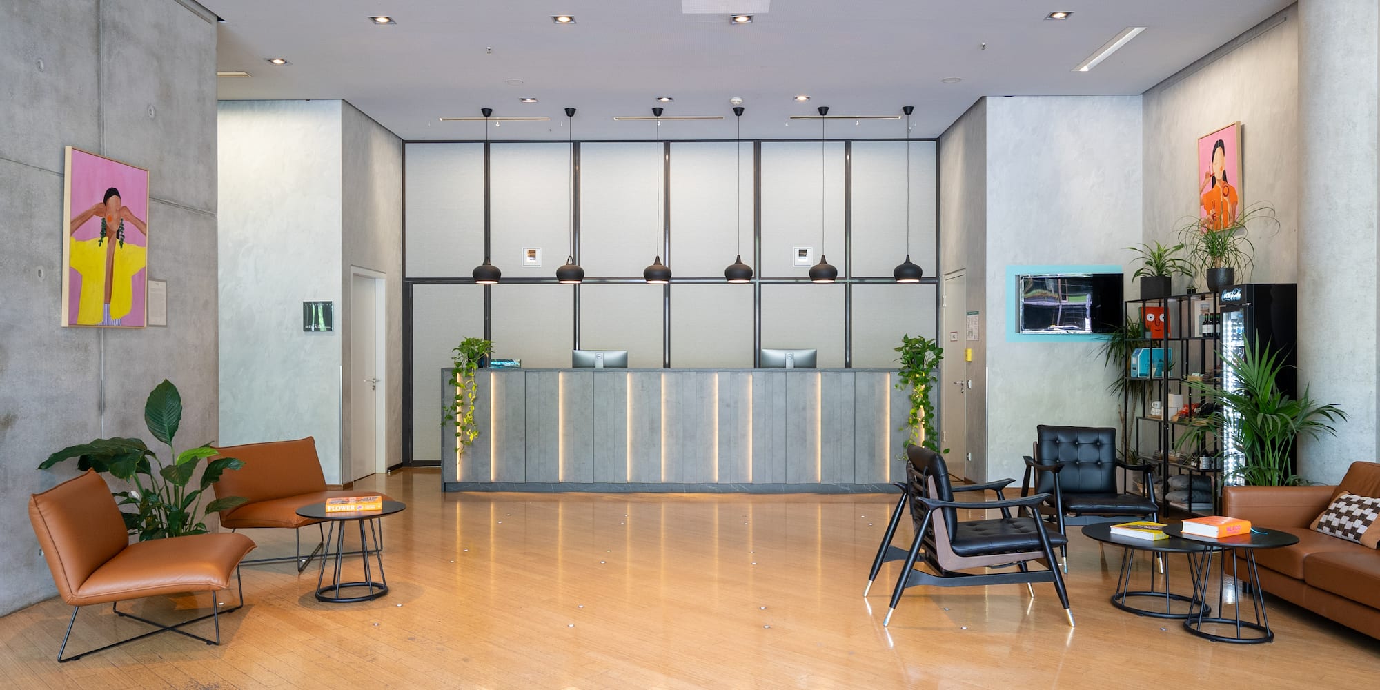 a lobby with a reception desk and chairs