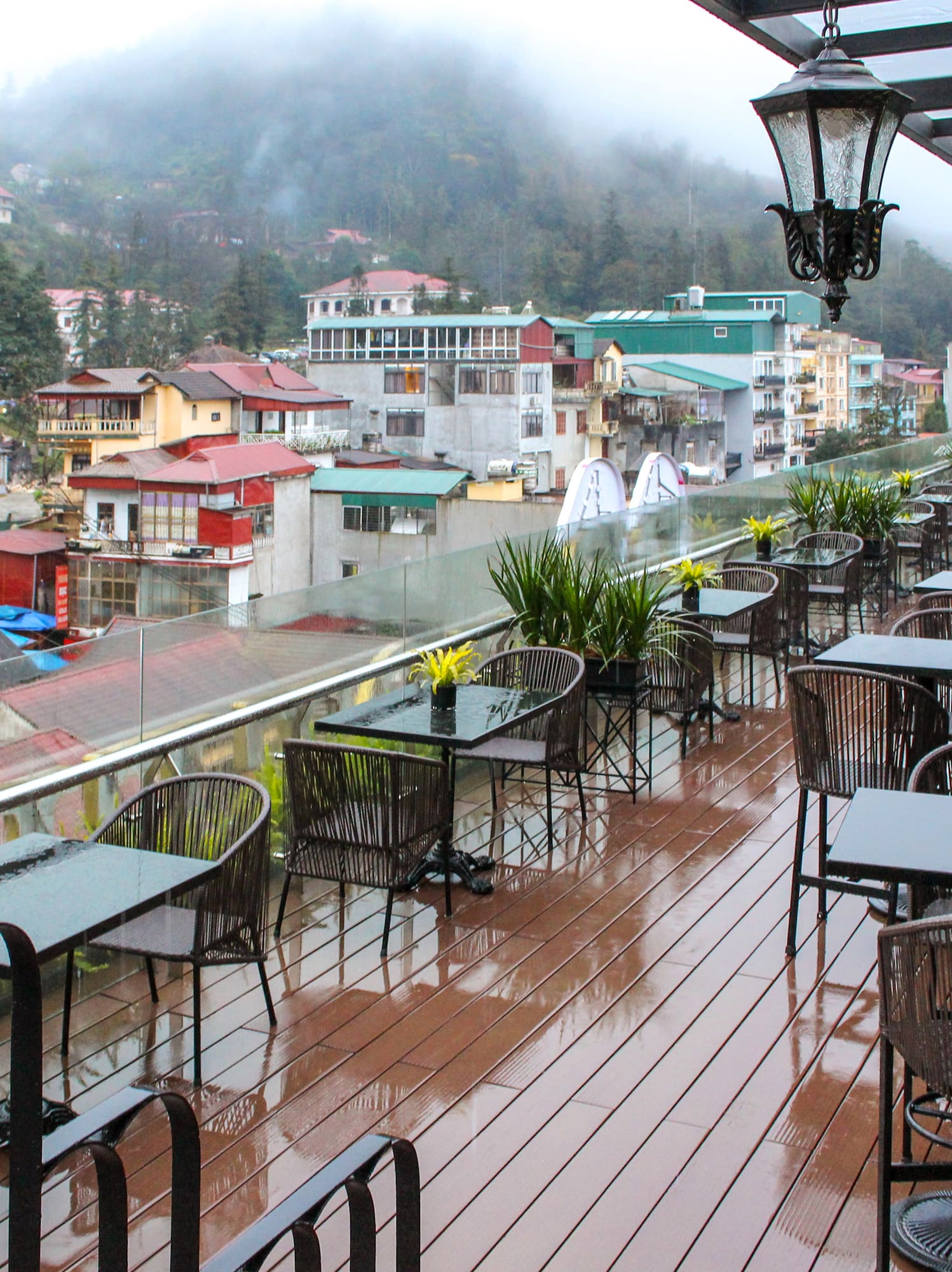 a restaurant with tables and chairs on a deck