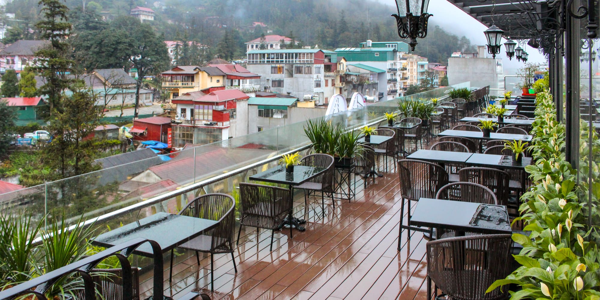 a restaurant with tables and chairs on a deck