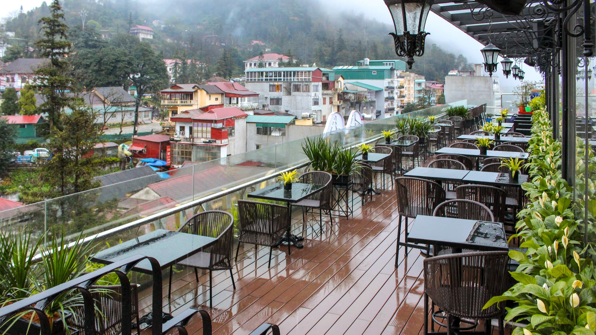 a restaurant with tables and chairs on a deck