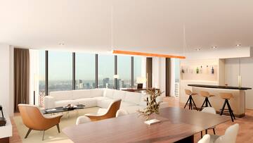 a living room with a large window overlooking a city