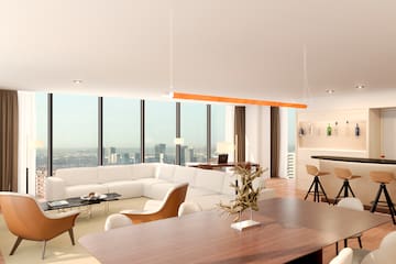 a living room with a large window overlooking a city