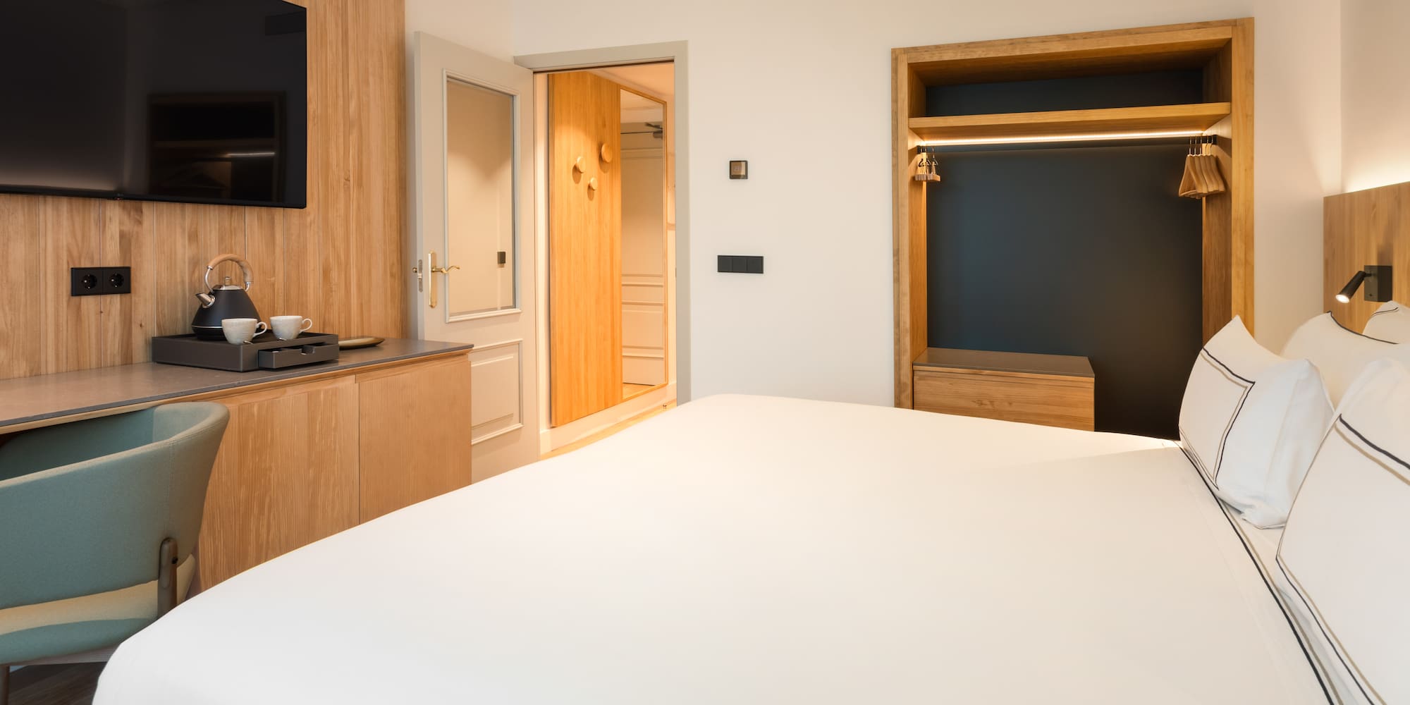 a room with a bed and a tv