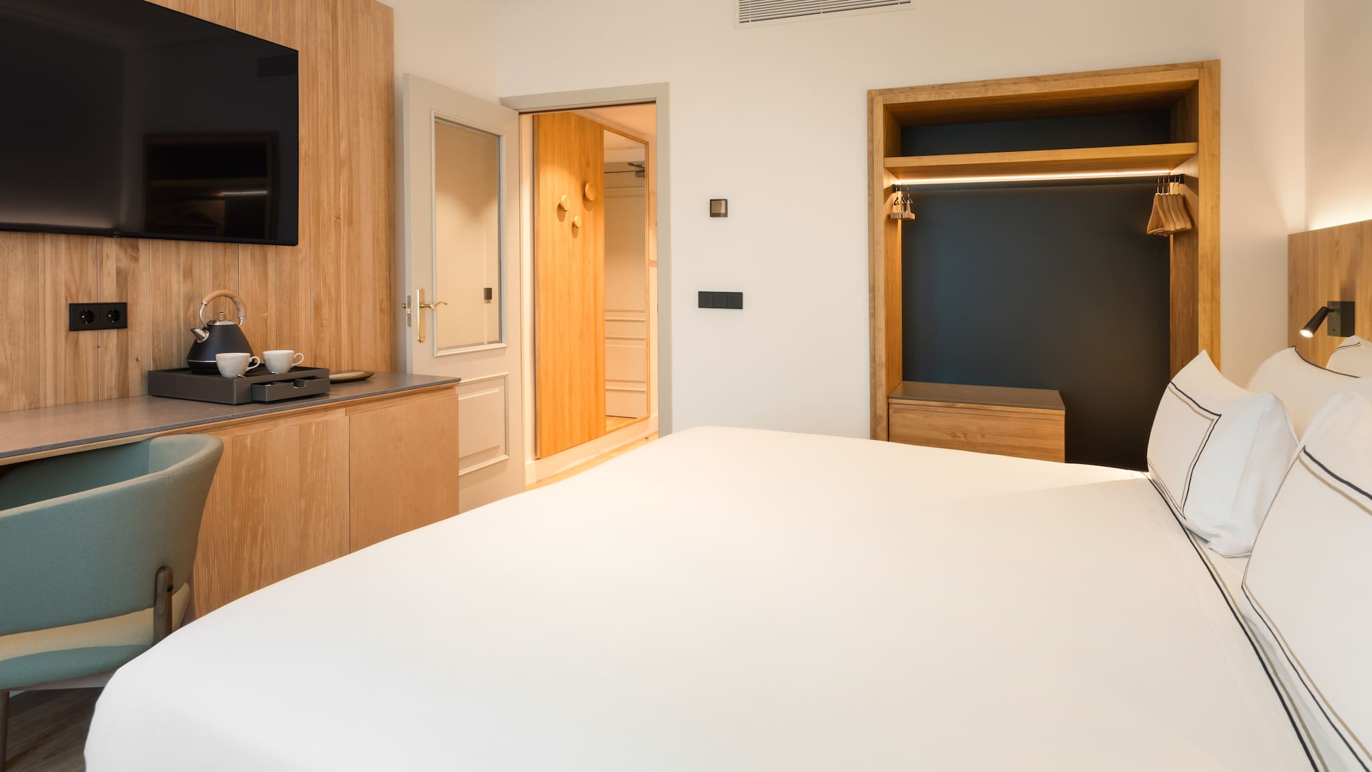 a room with a bed and a tv