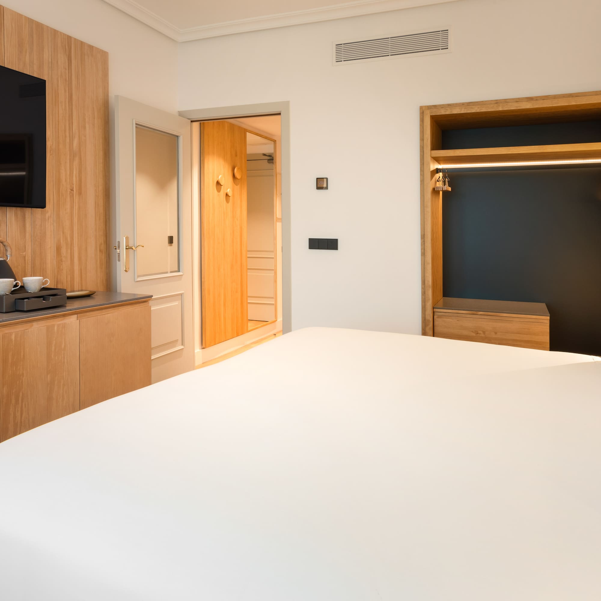 a room with a bed and a tv