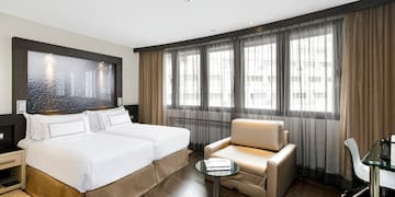 a room with two beds and a table