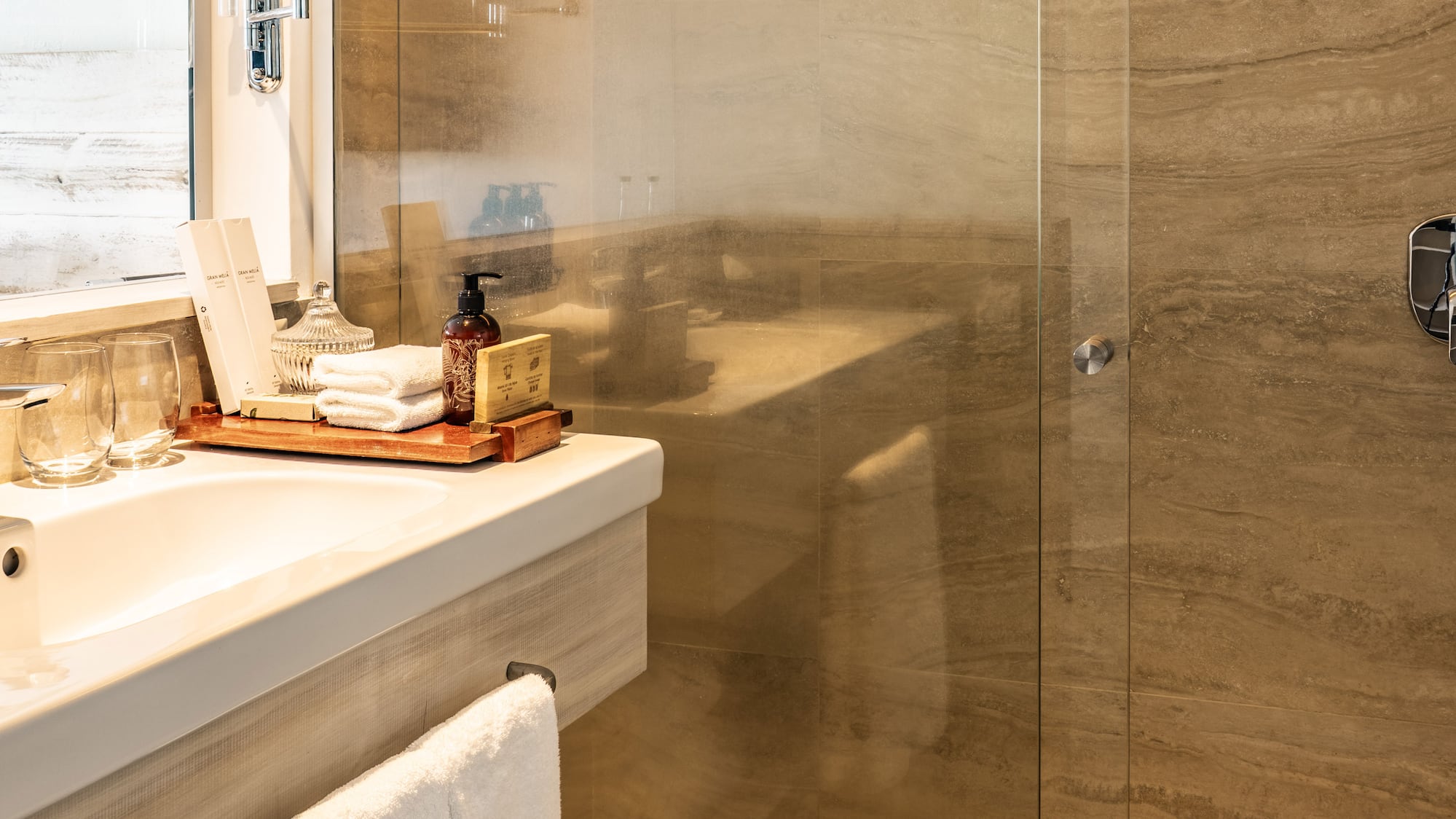 a bathroom with a glass shower door