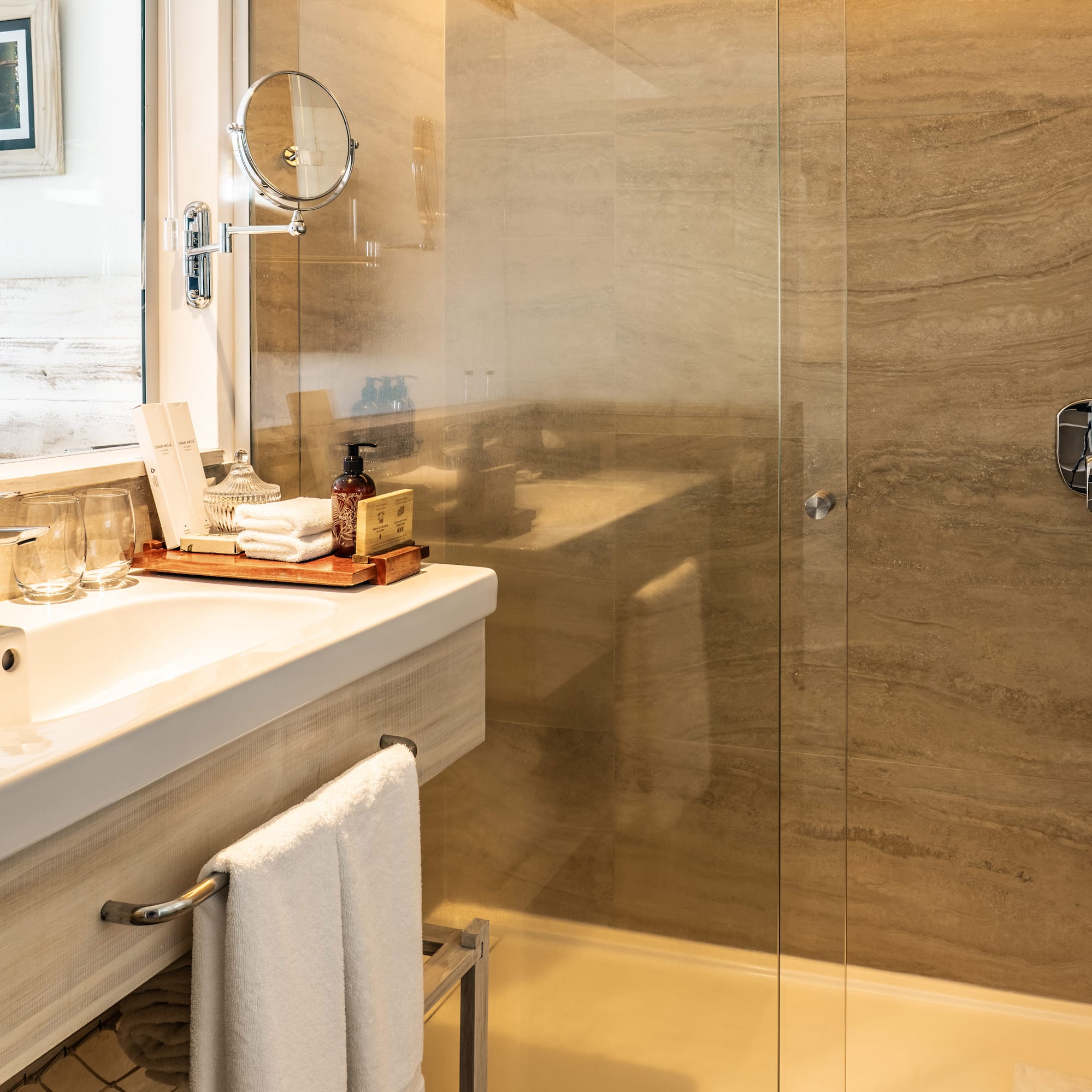 a bathroom with a glass shower door