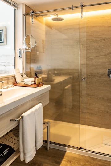 a bathroom with a glass shower door
