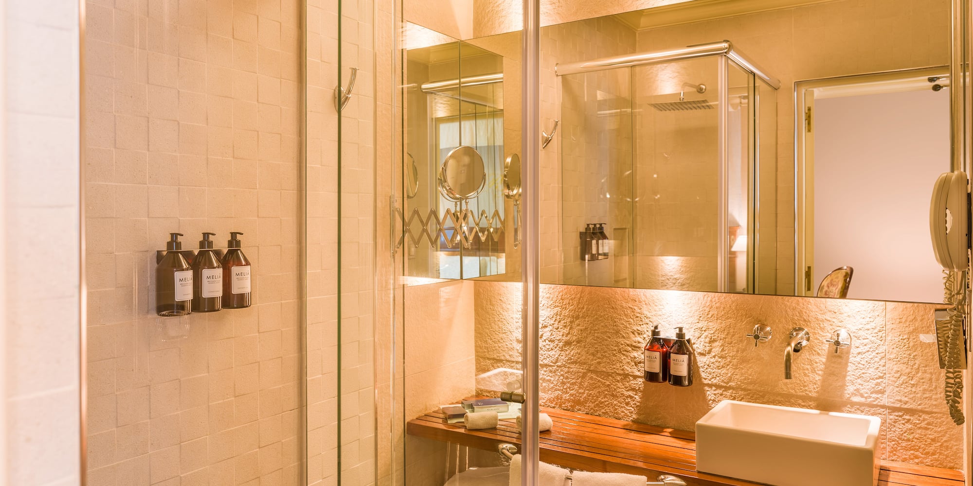 a bathroom with a glass shower door