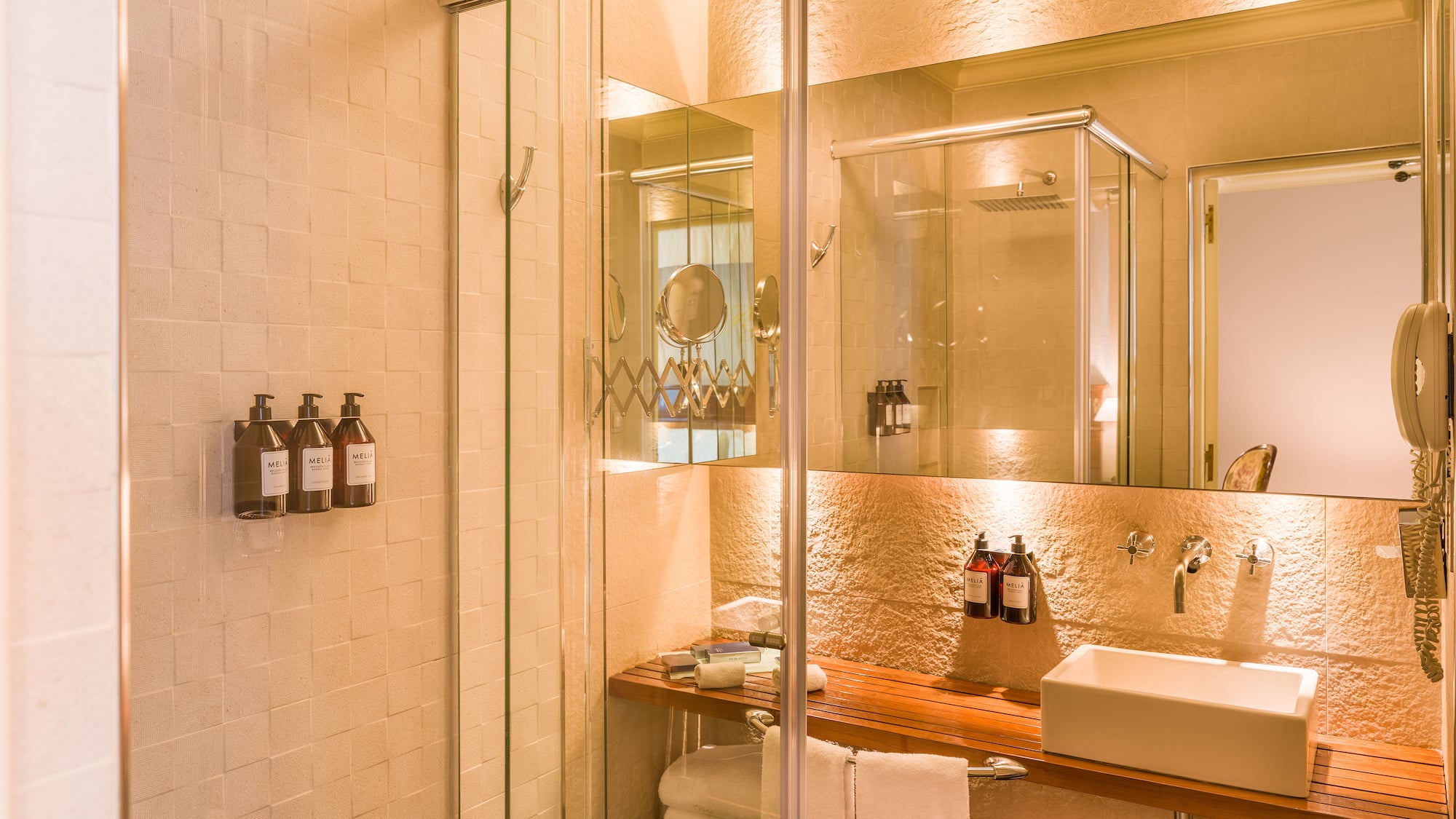 a bathroom with a glass shower door