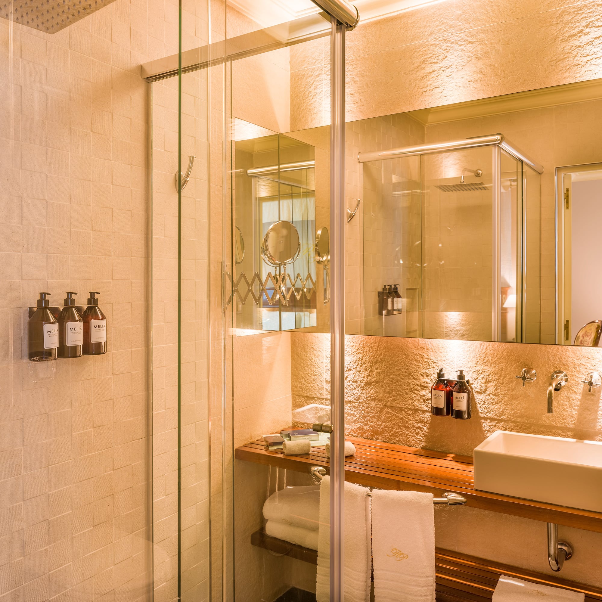 a bathroom with a glass shower door