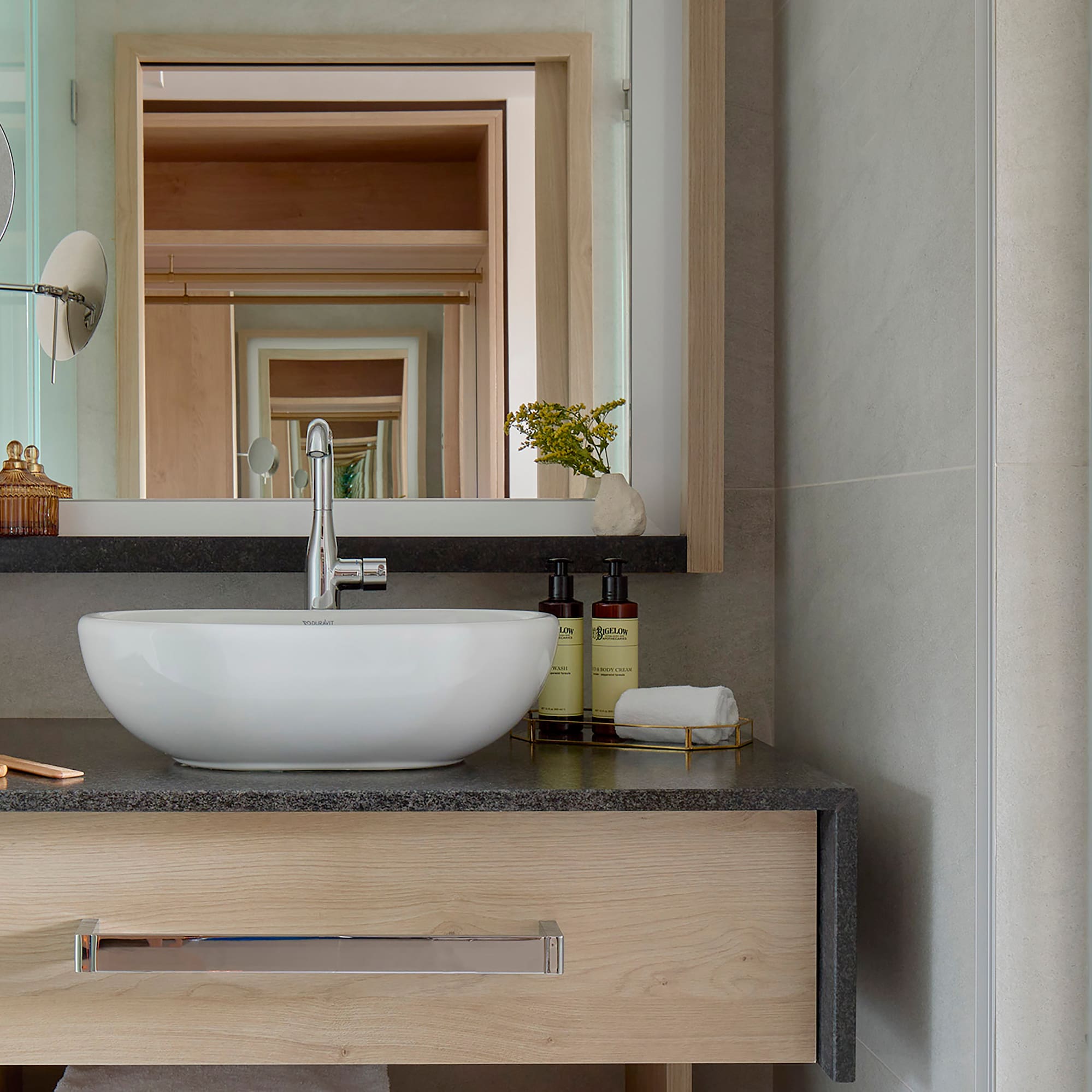 a bathroom sink with a mirror