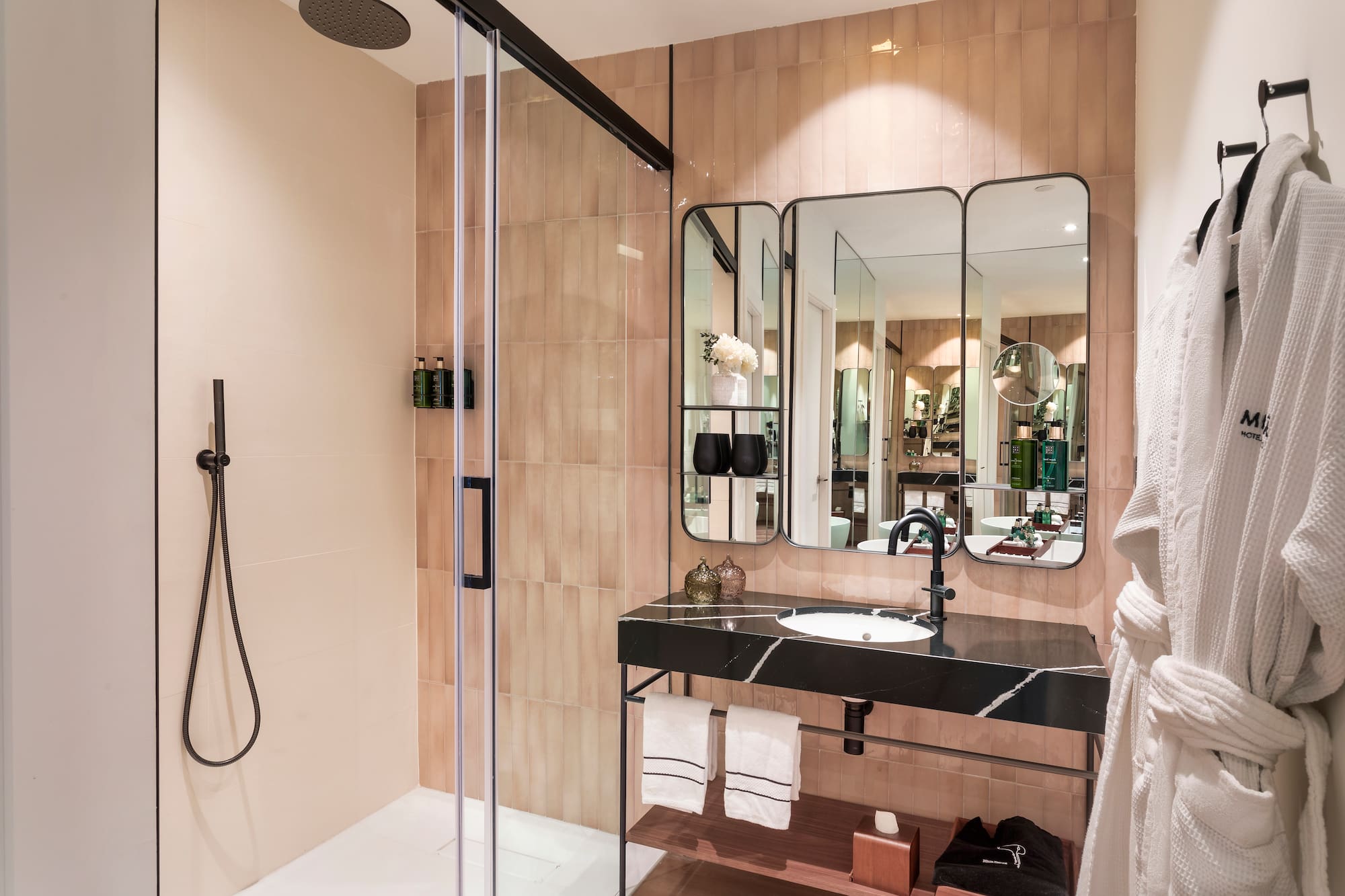 a bathroom with a shower and a sink