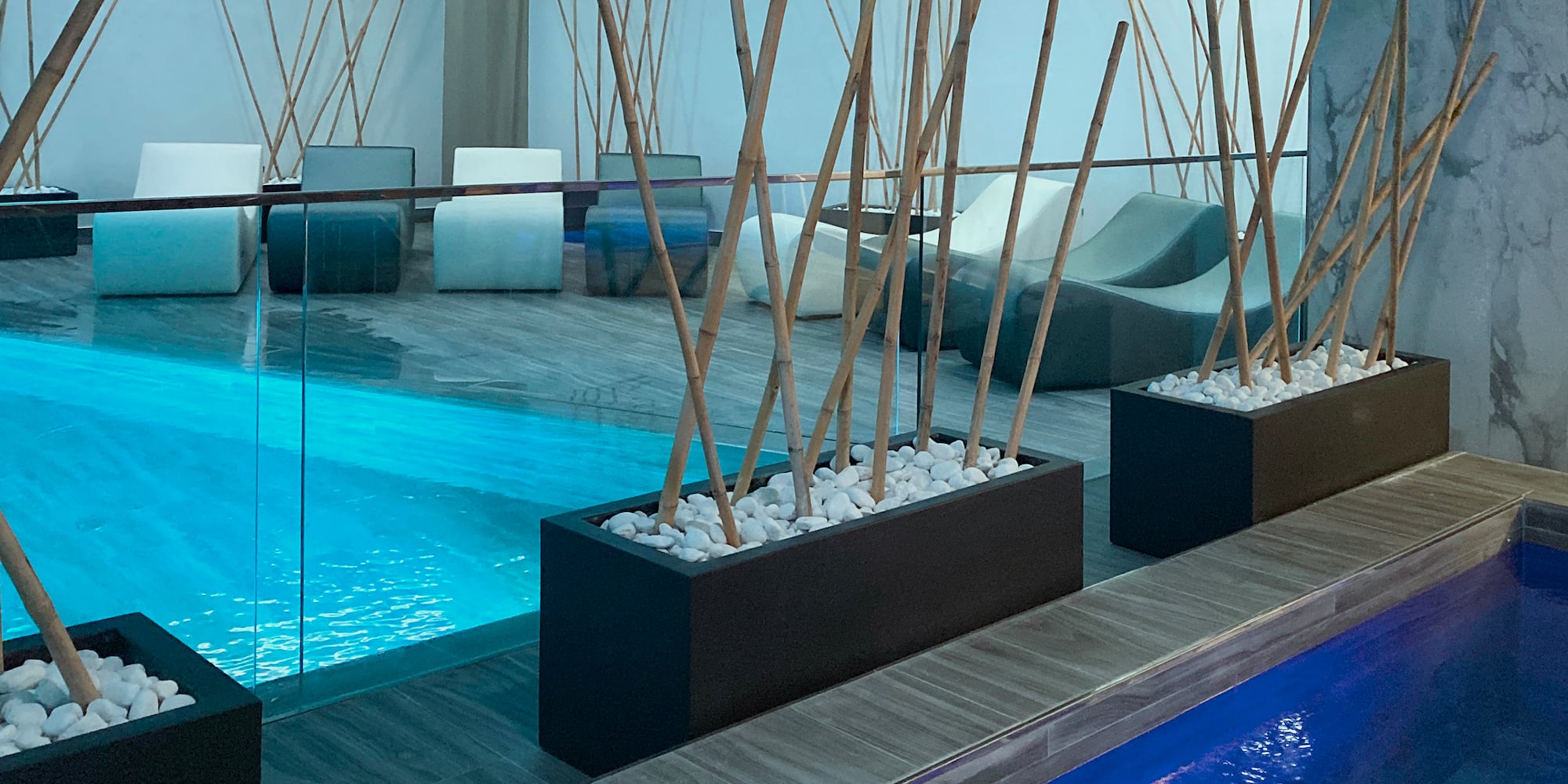 a pool with a pool and a room with a pool and a pool